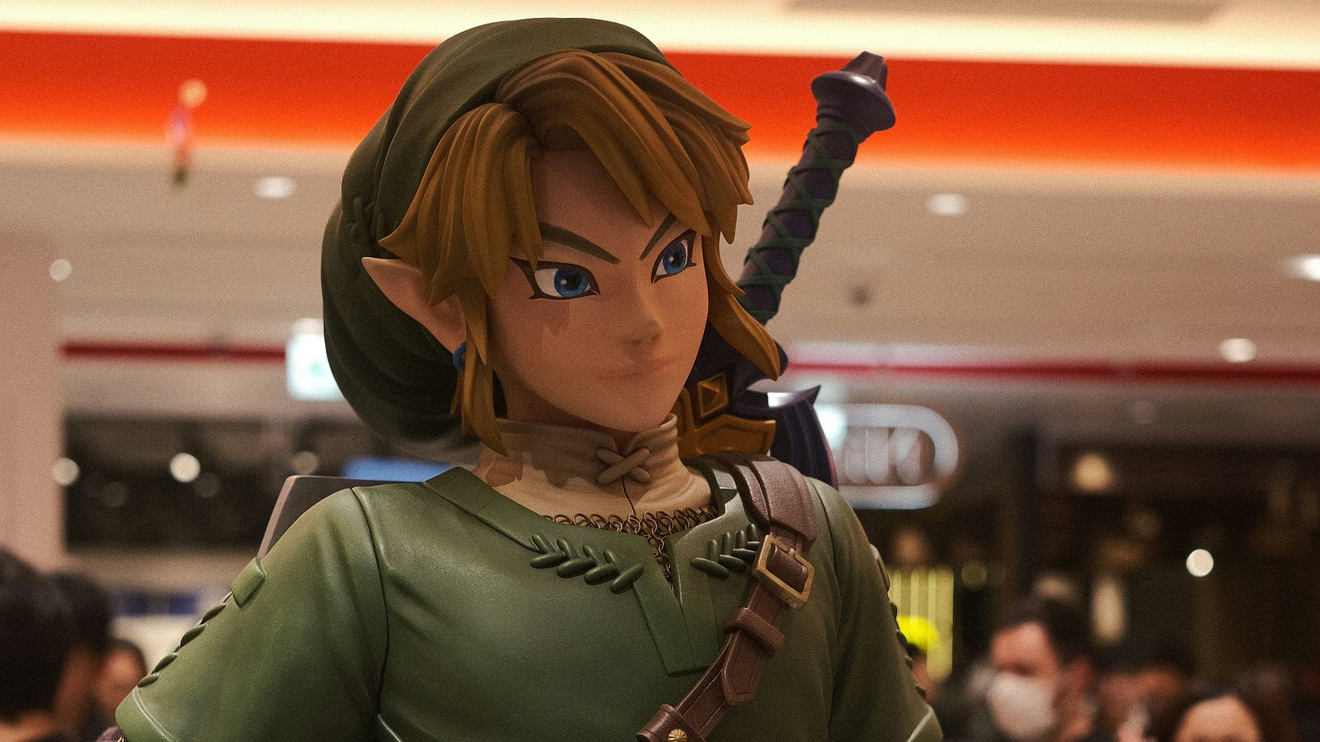 a statue of a woman in a green outfit