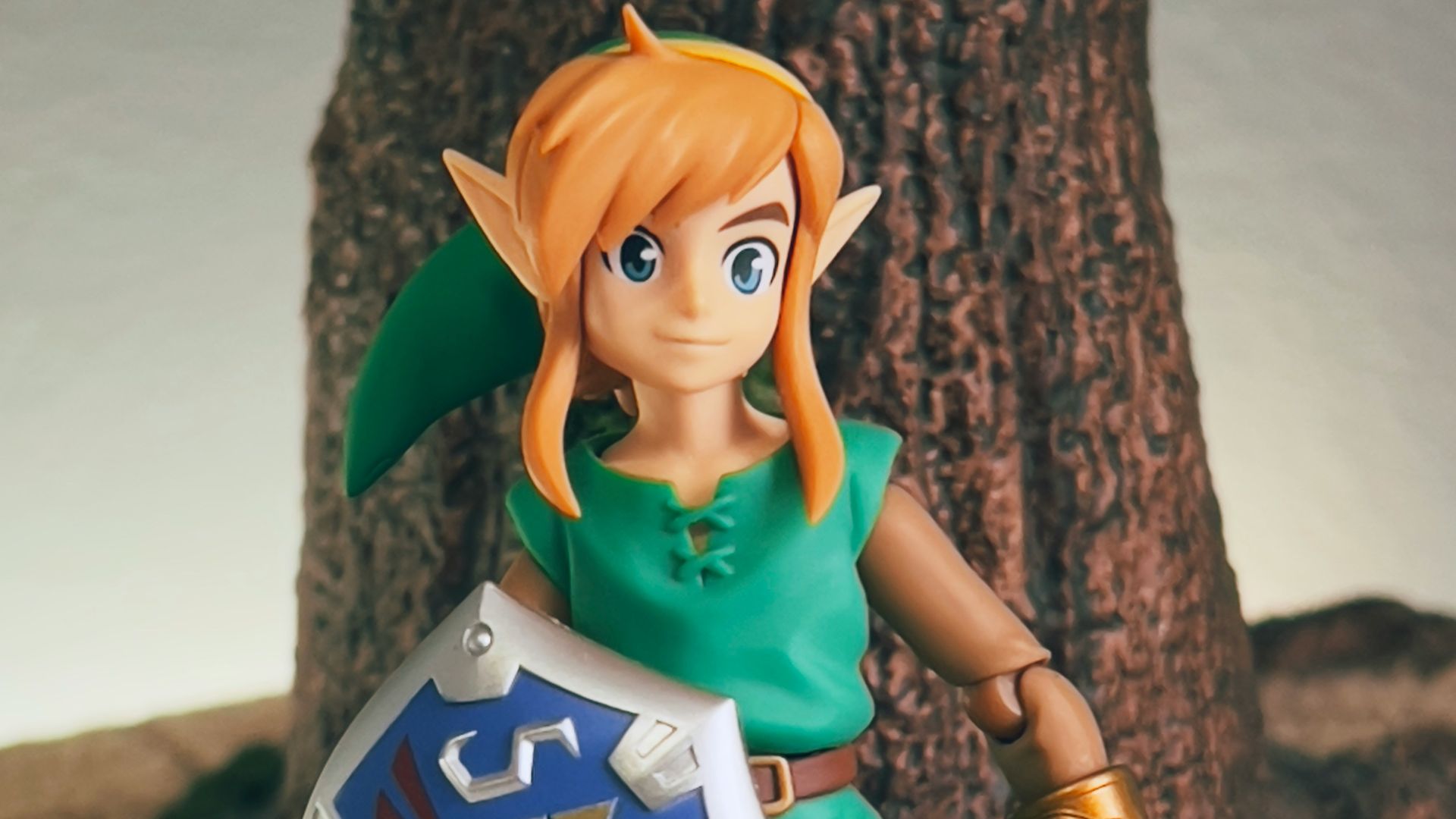 a toy girl holding a sign