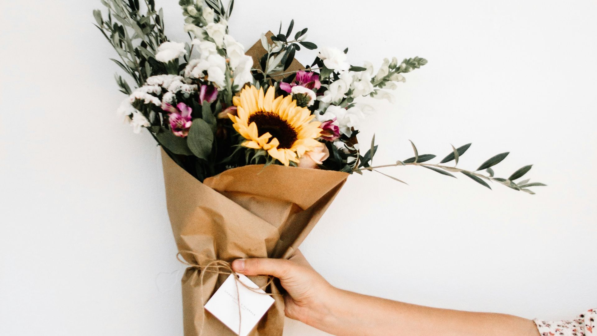 person holding bouquet of flowers