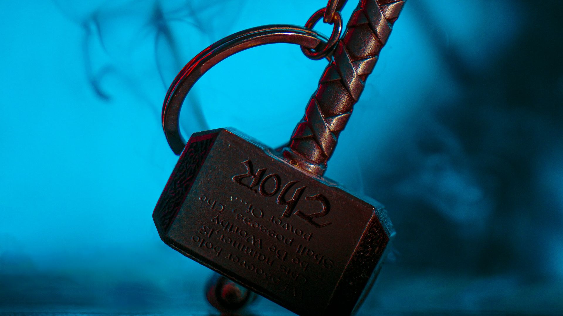 a metal hook with a sign on it