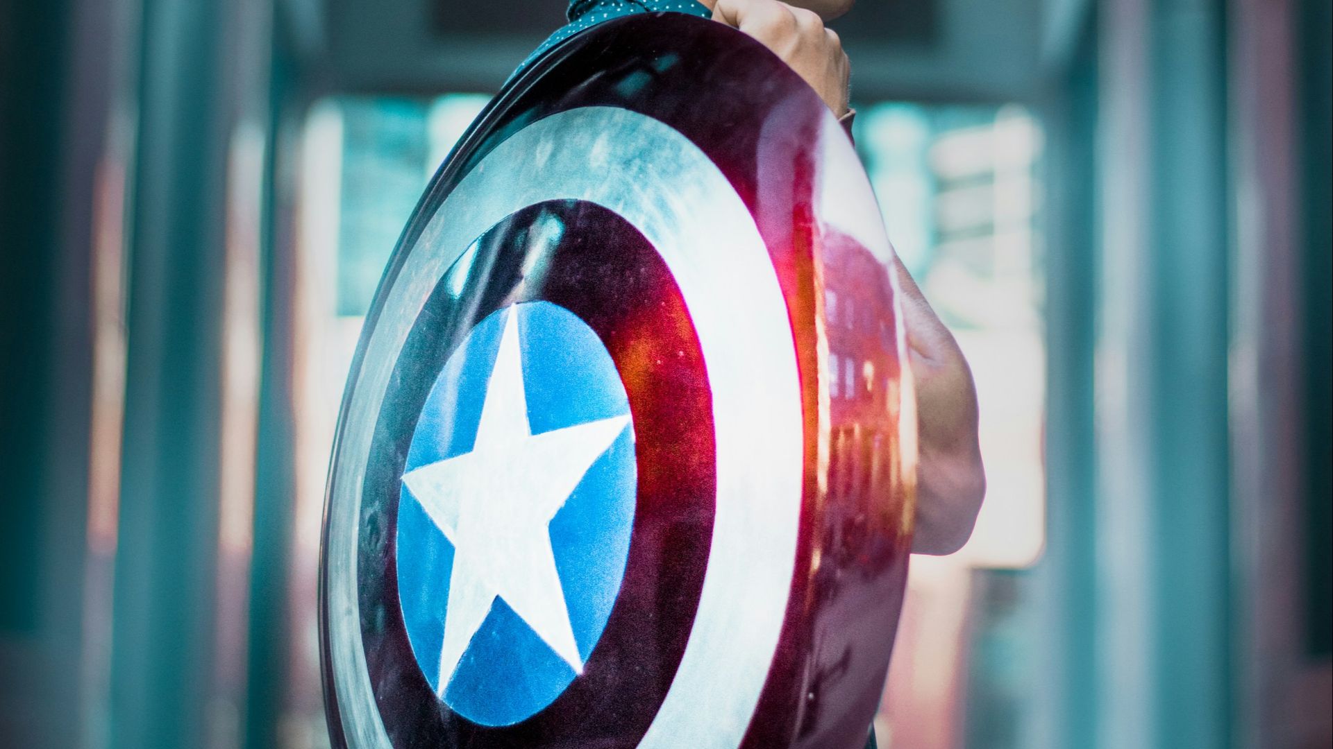 man carrying Captain America's shield