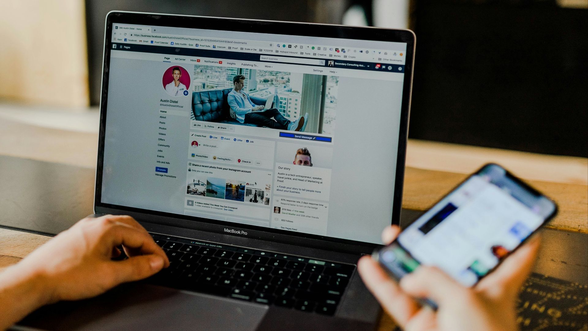 person using both laptop and smartphone