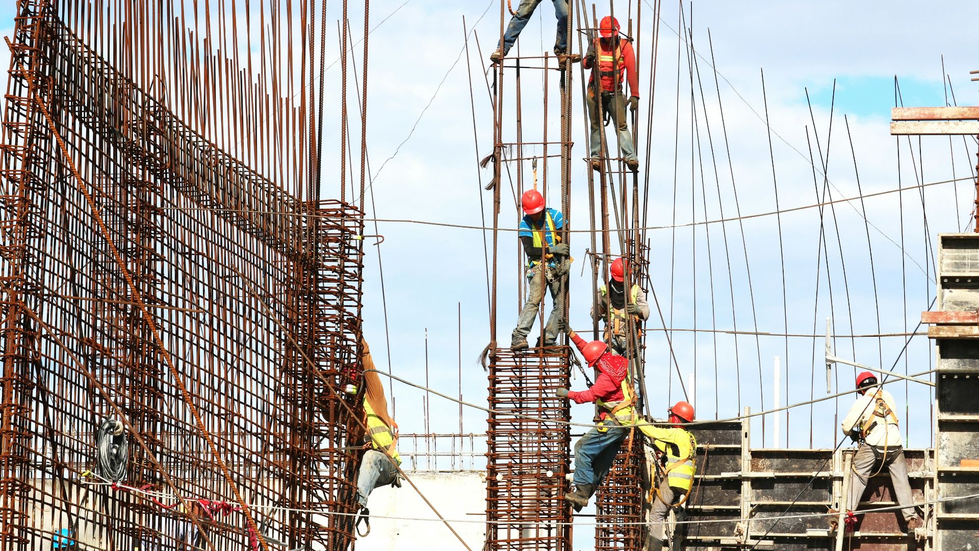 people working on building during daytime