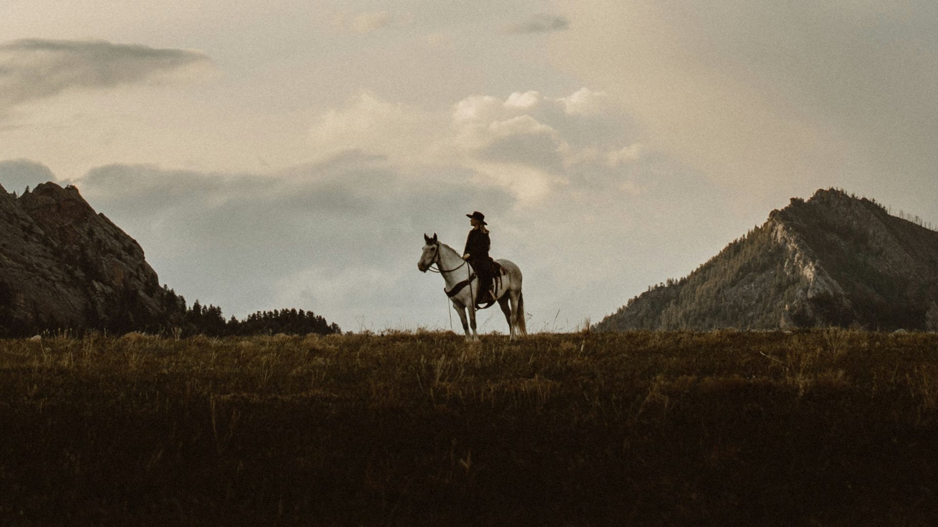 2 men walking on green grass field during daytime