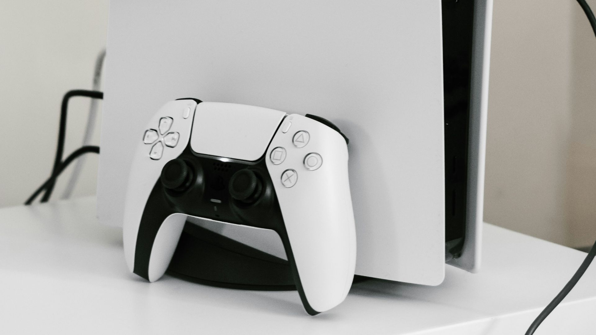 white playstation five console and controller
