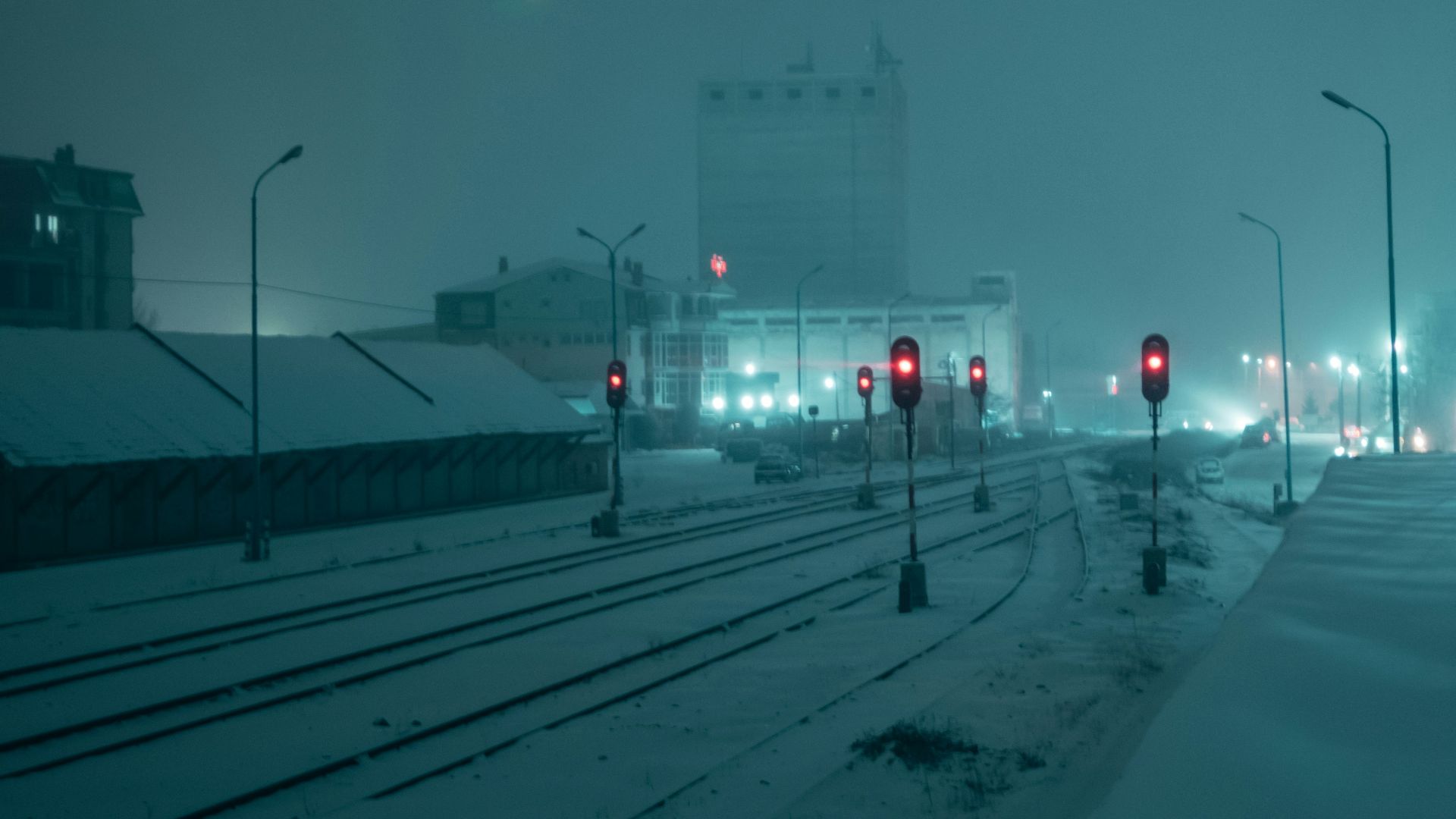 white tower near road during night time