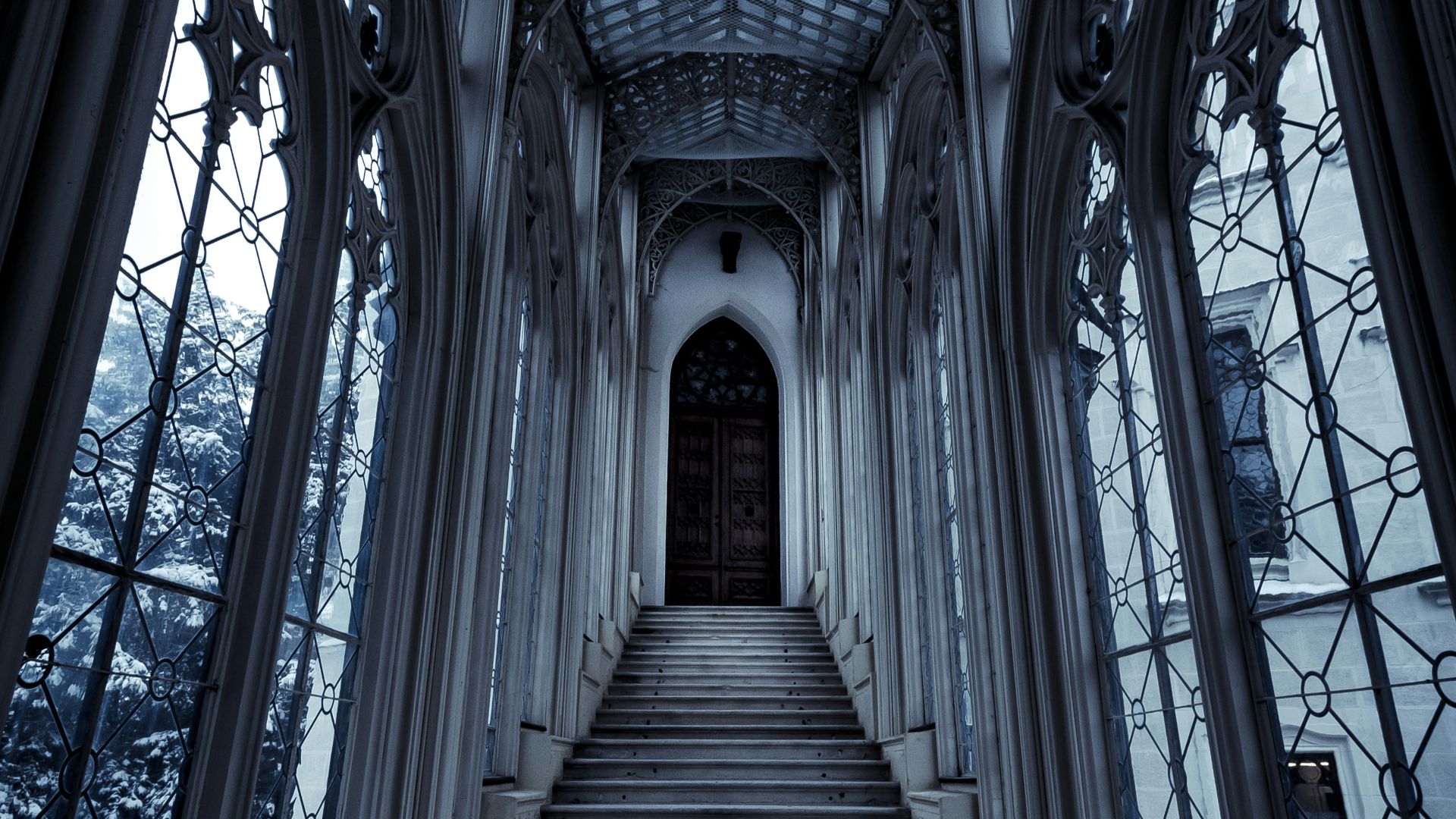 a set of stairs leading up to a large window