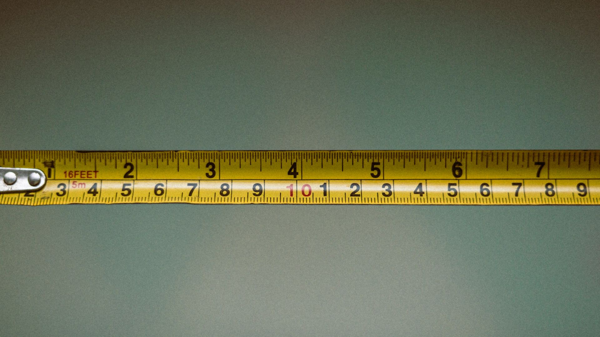 a person holding a tape measure in their hand