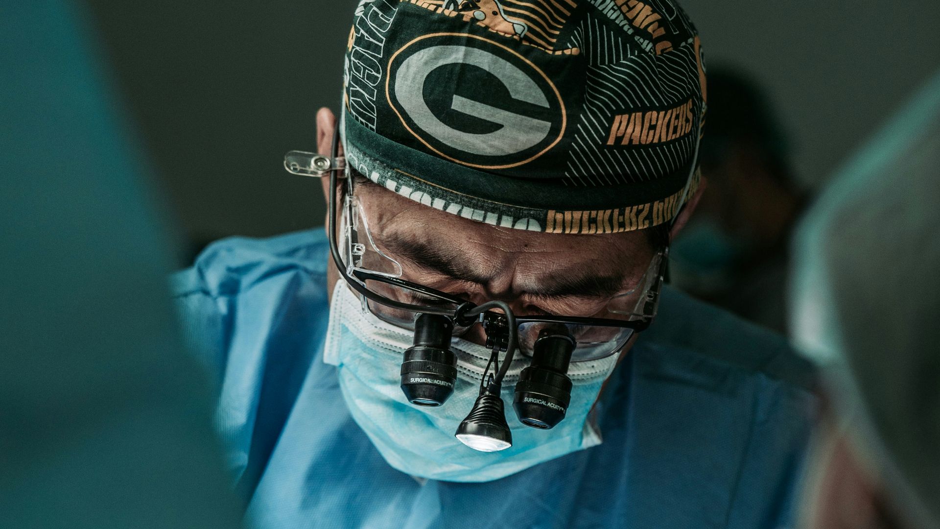 doctor wearing Green Bay Packers hat