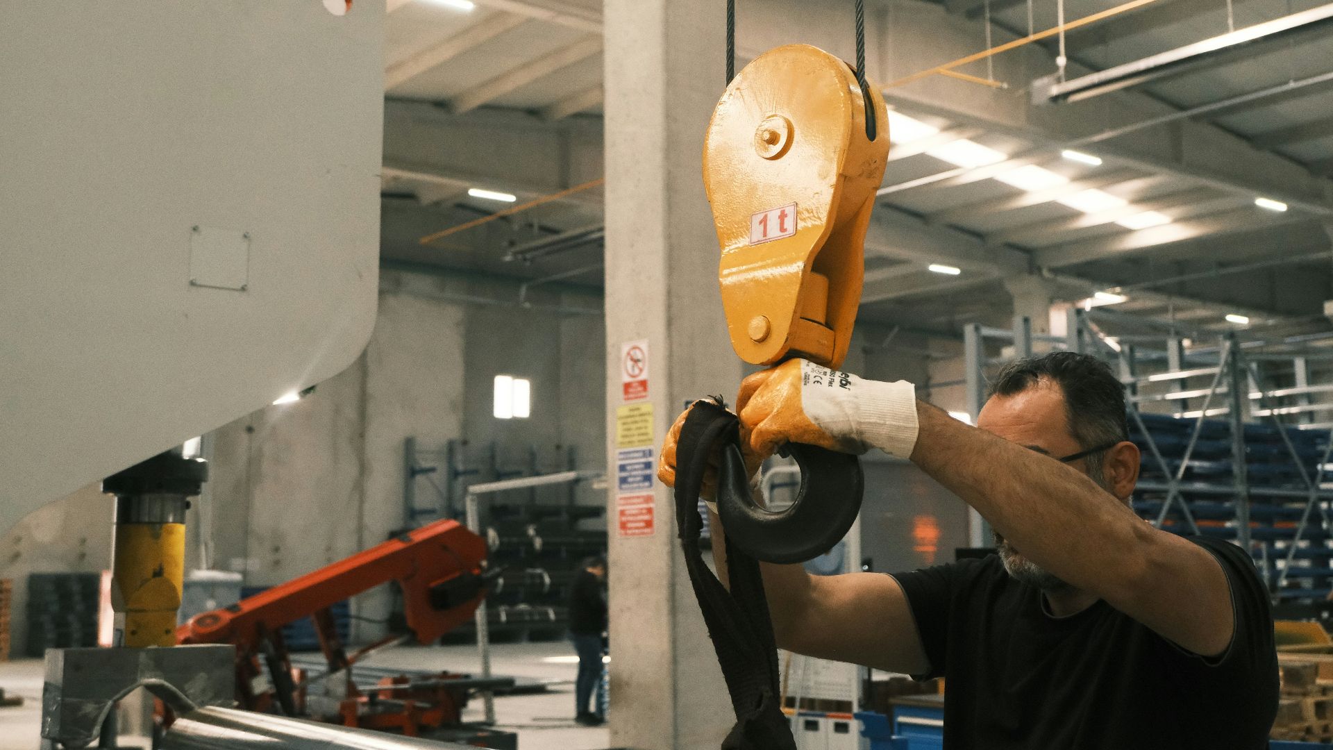 A man working on a machine in a factory