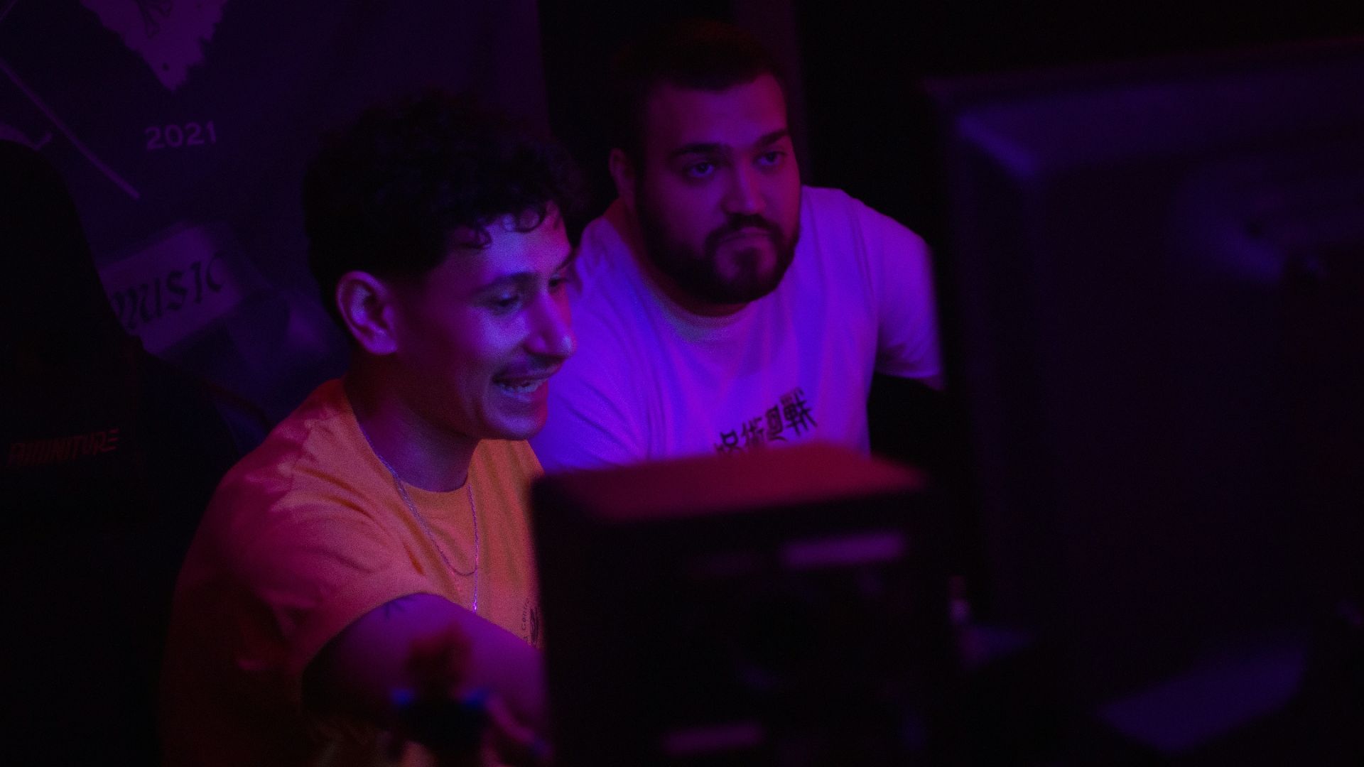 Two men looking at a computer screen