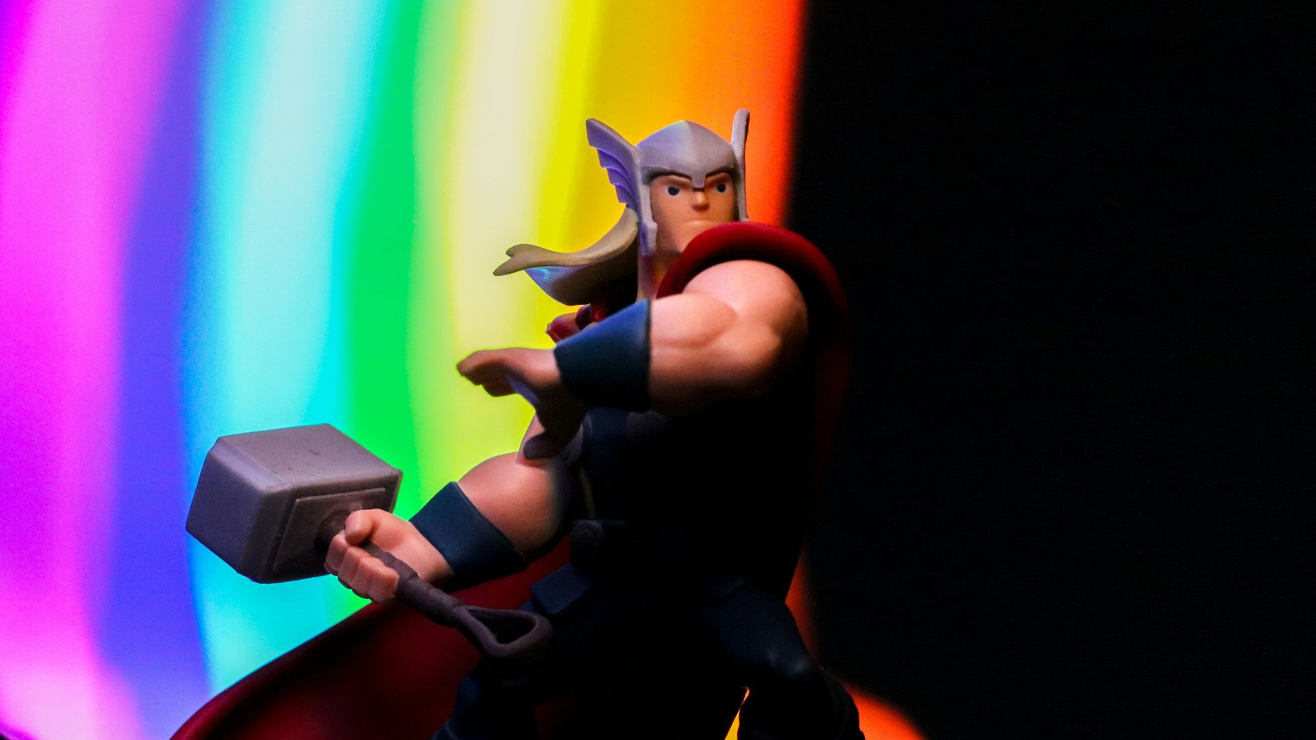 a toy of a man with a hammer in his hand