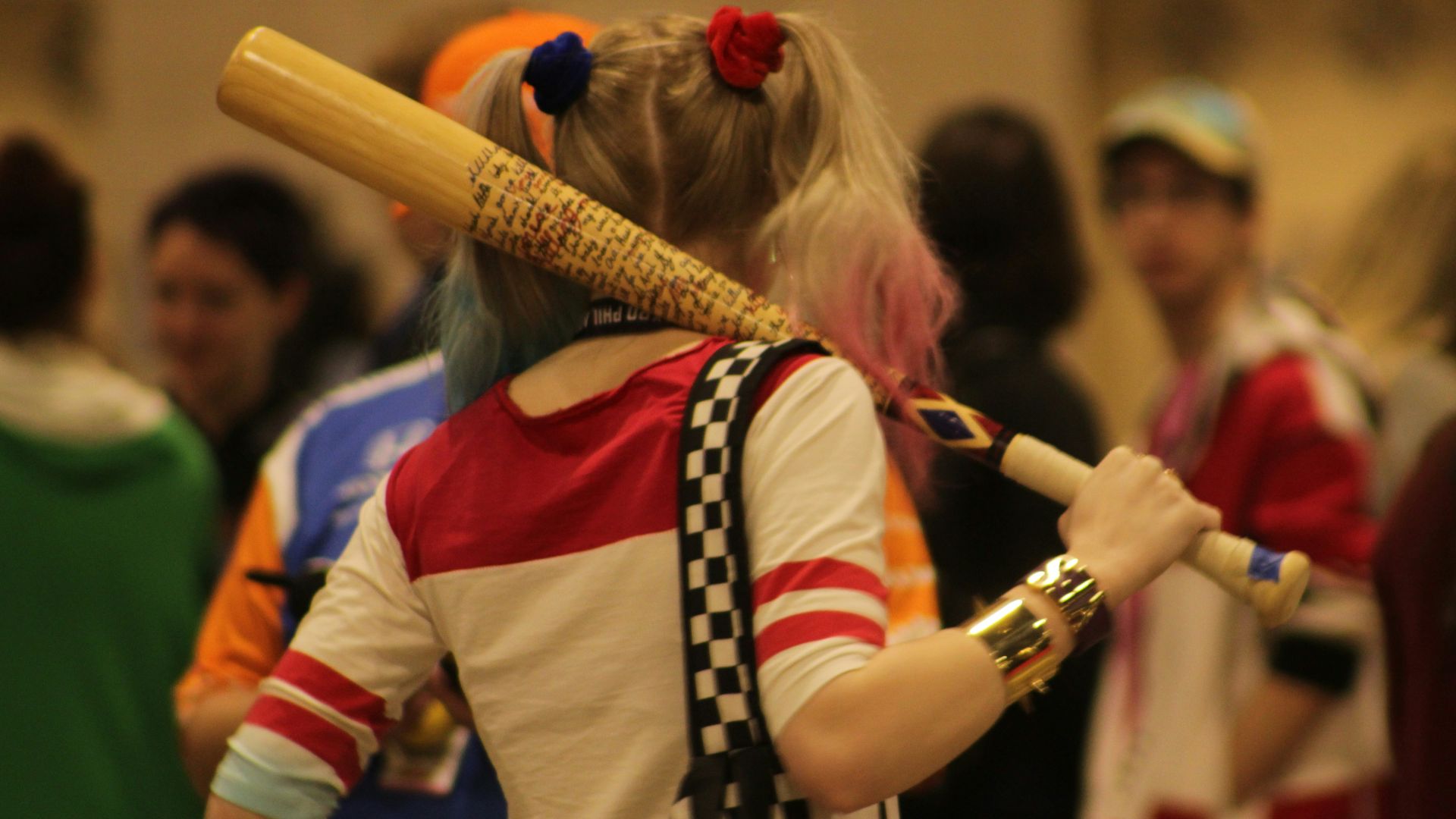 a woman with a baseball bat in her hand
