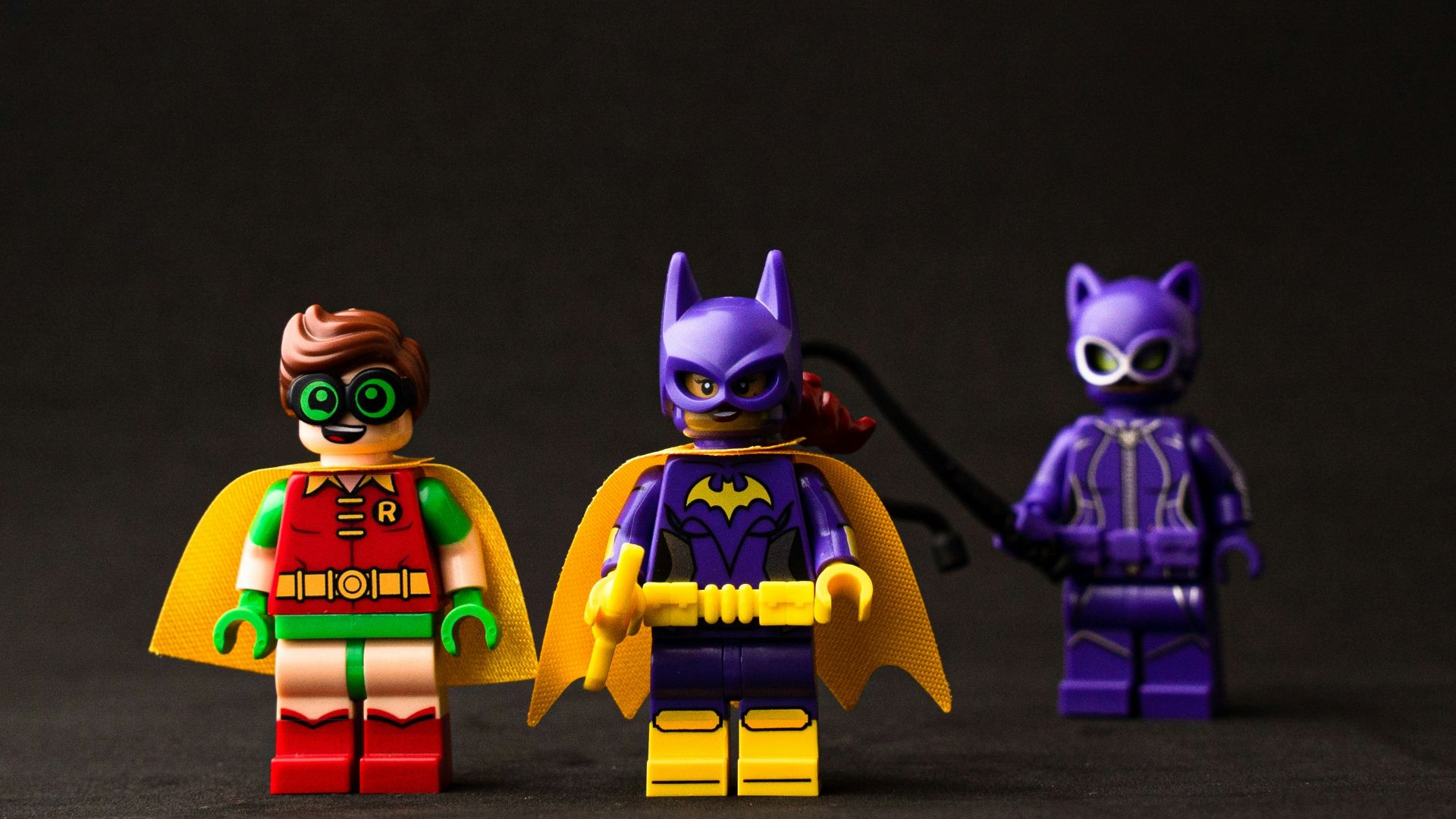two yellow and purple robot toys