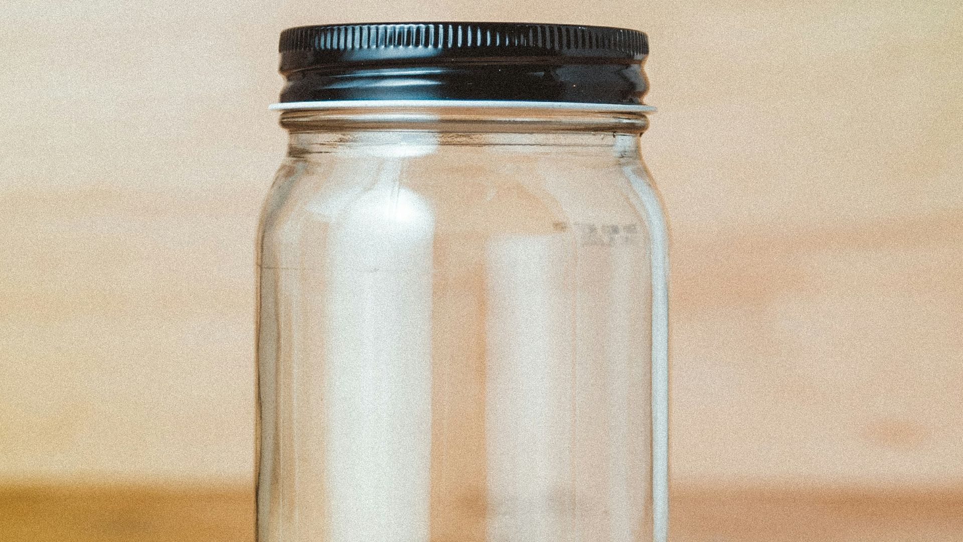 clear glass jar with white powder inside