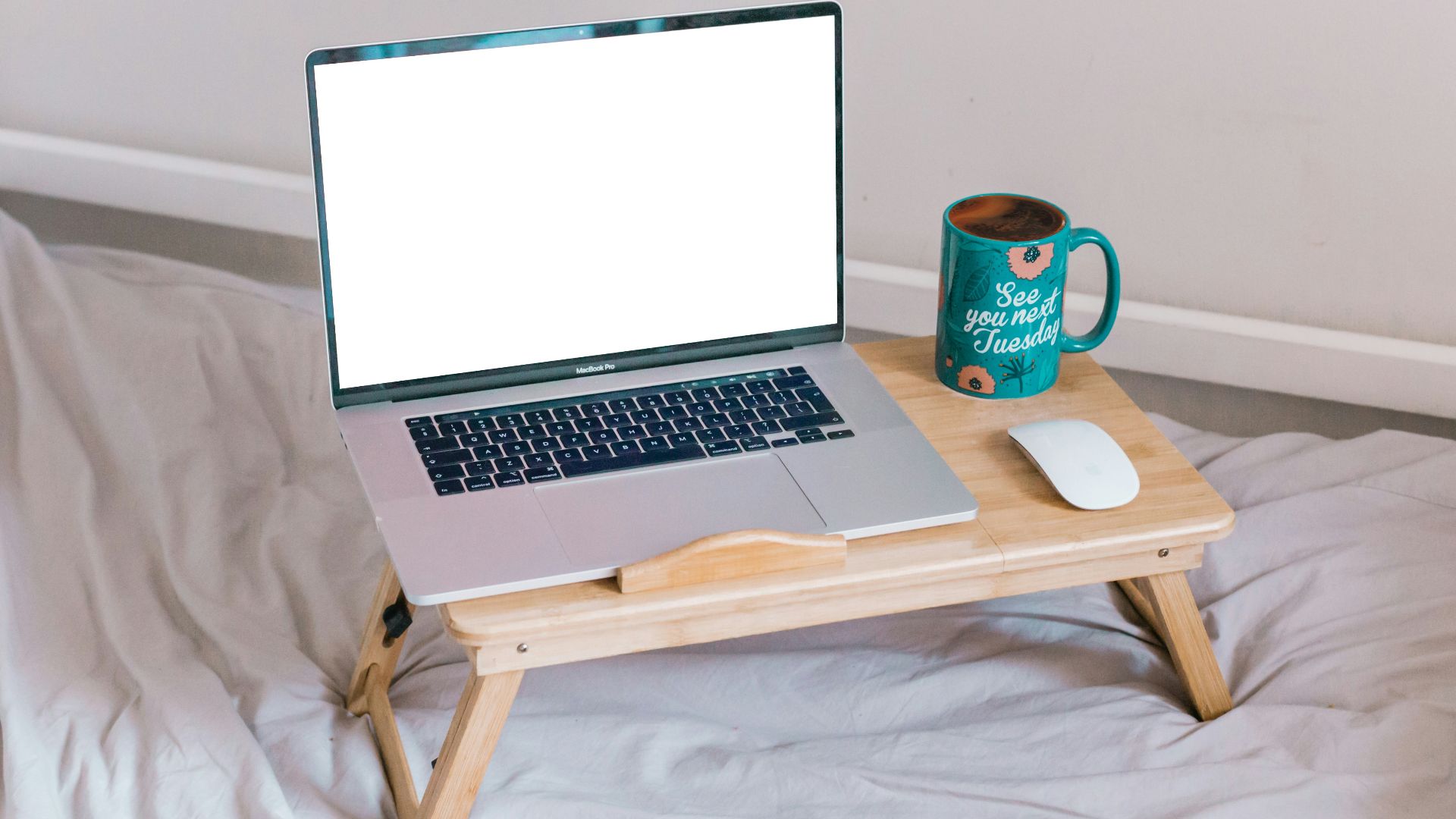 macbook air on brown wooden table