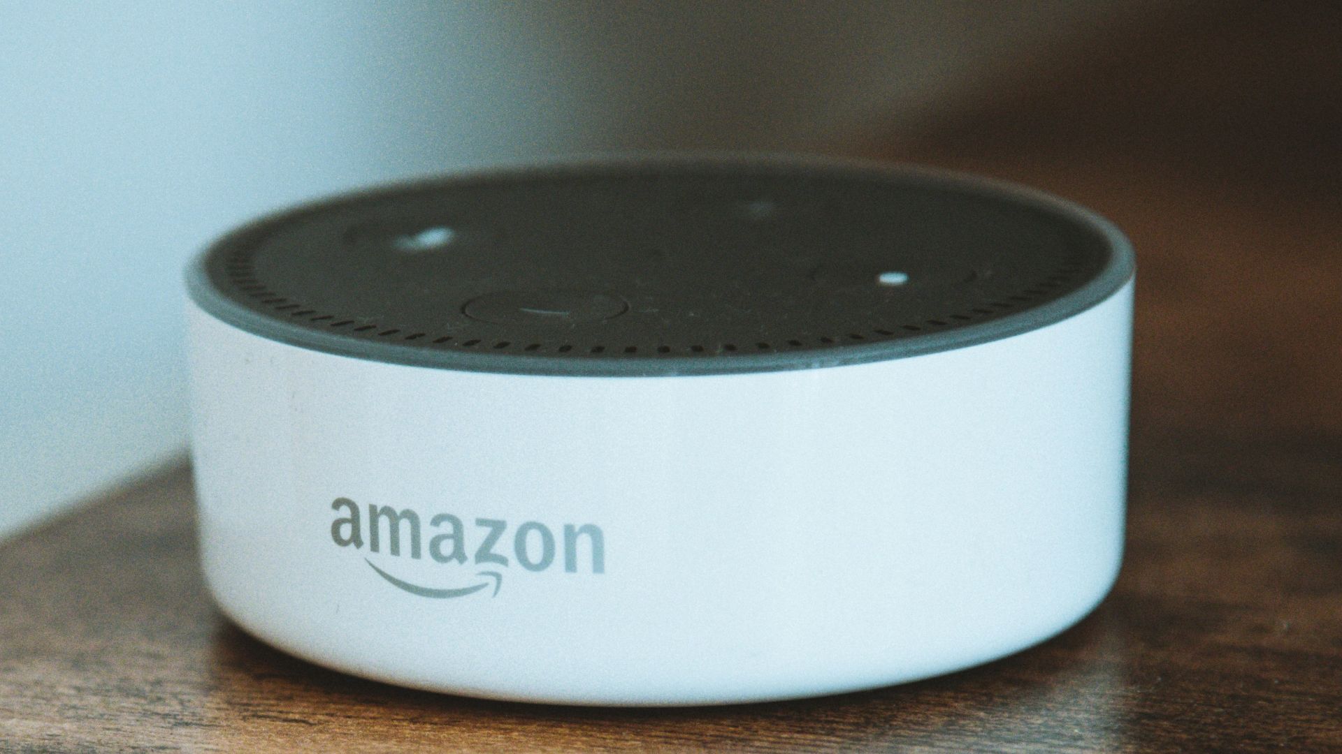 white and black round portable speaker