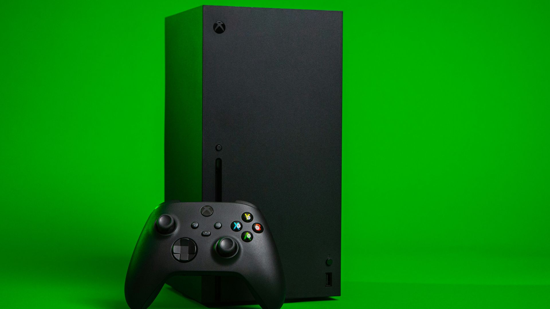 black xbox one console with controller