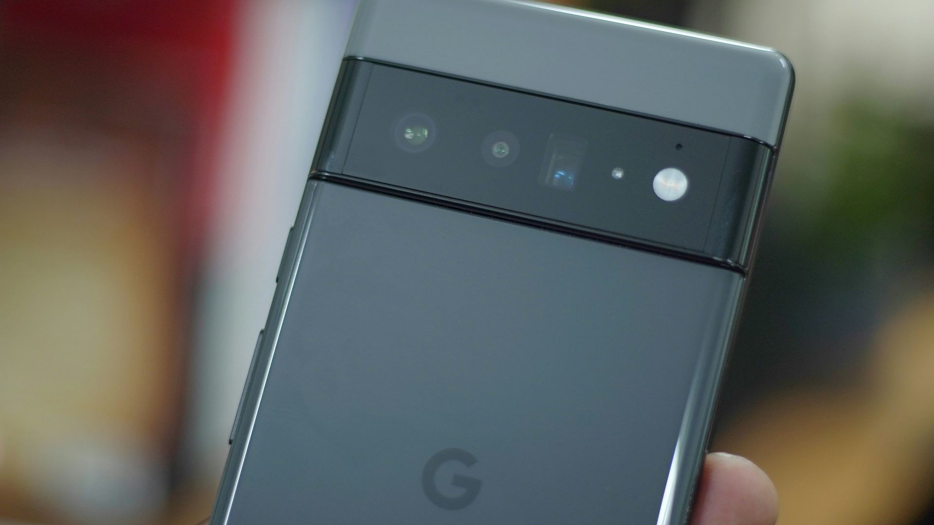a hand holding a cell phone
