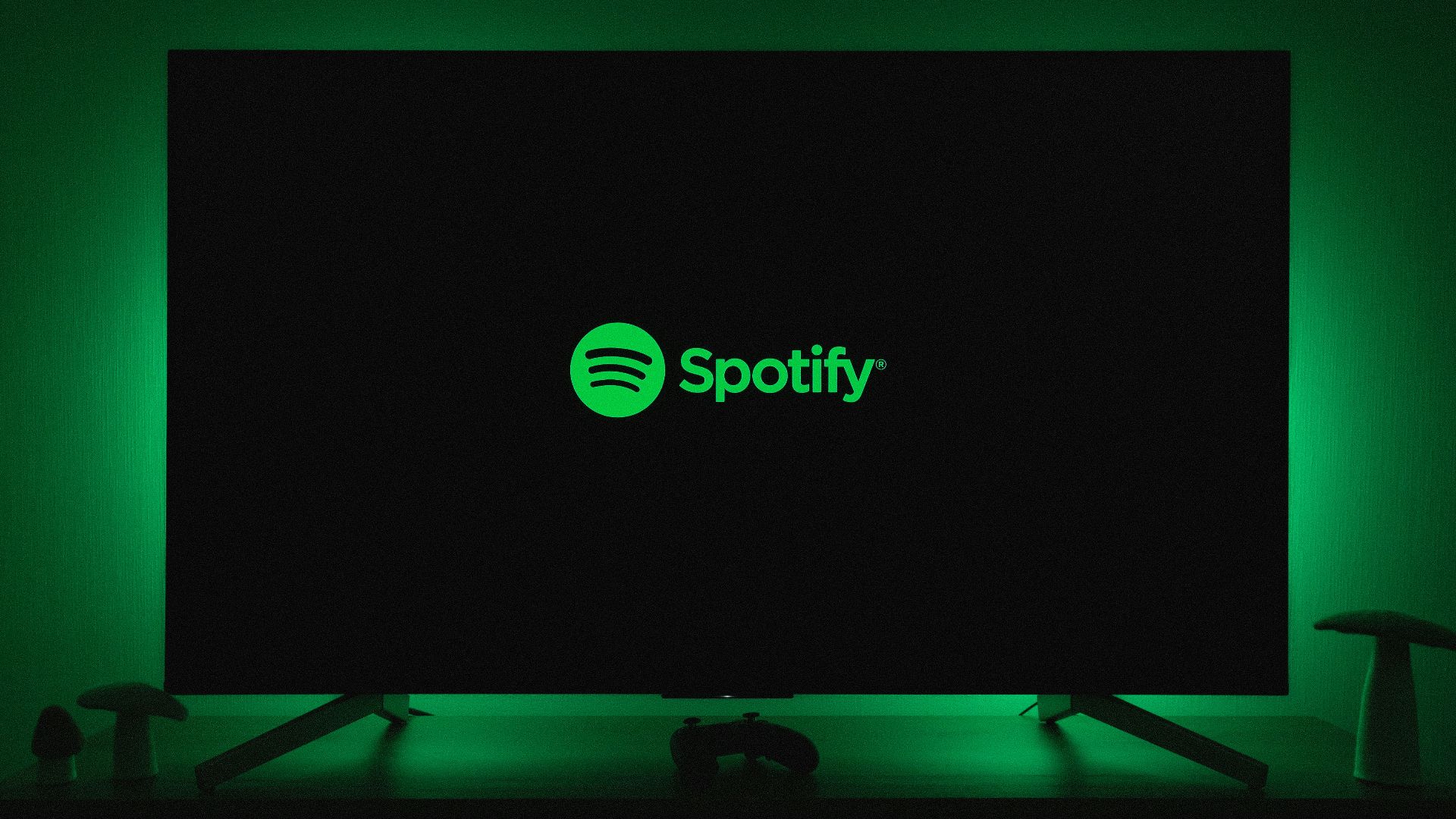 the spotify logo is lit up on a flat screen tv