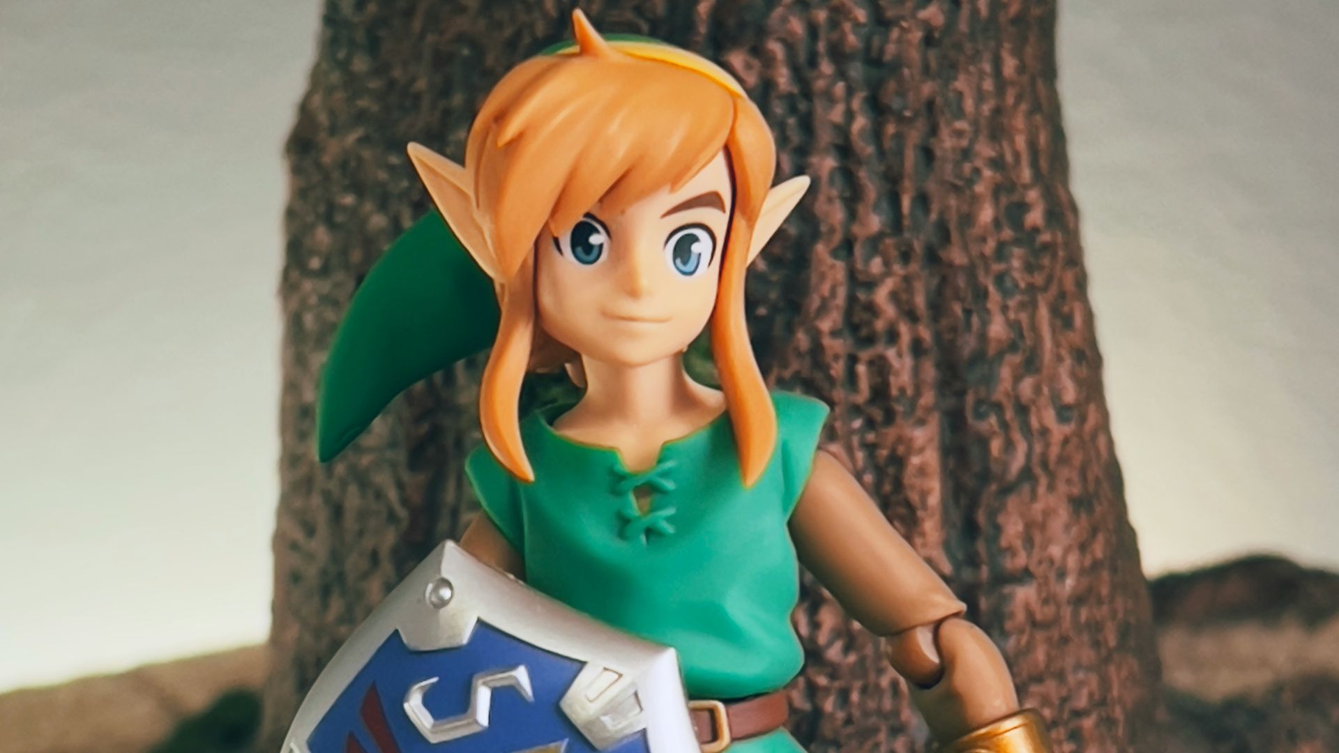 a toy girl holding a sign