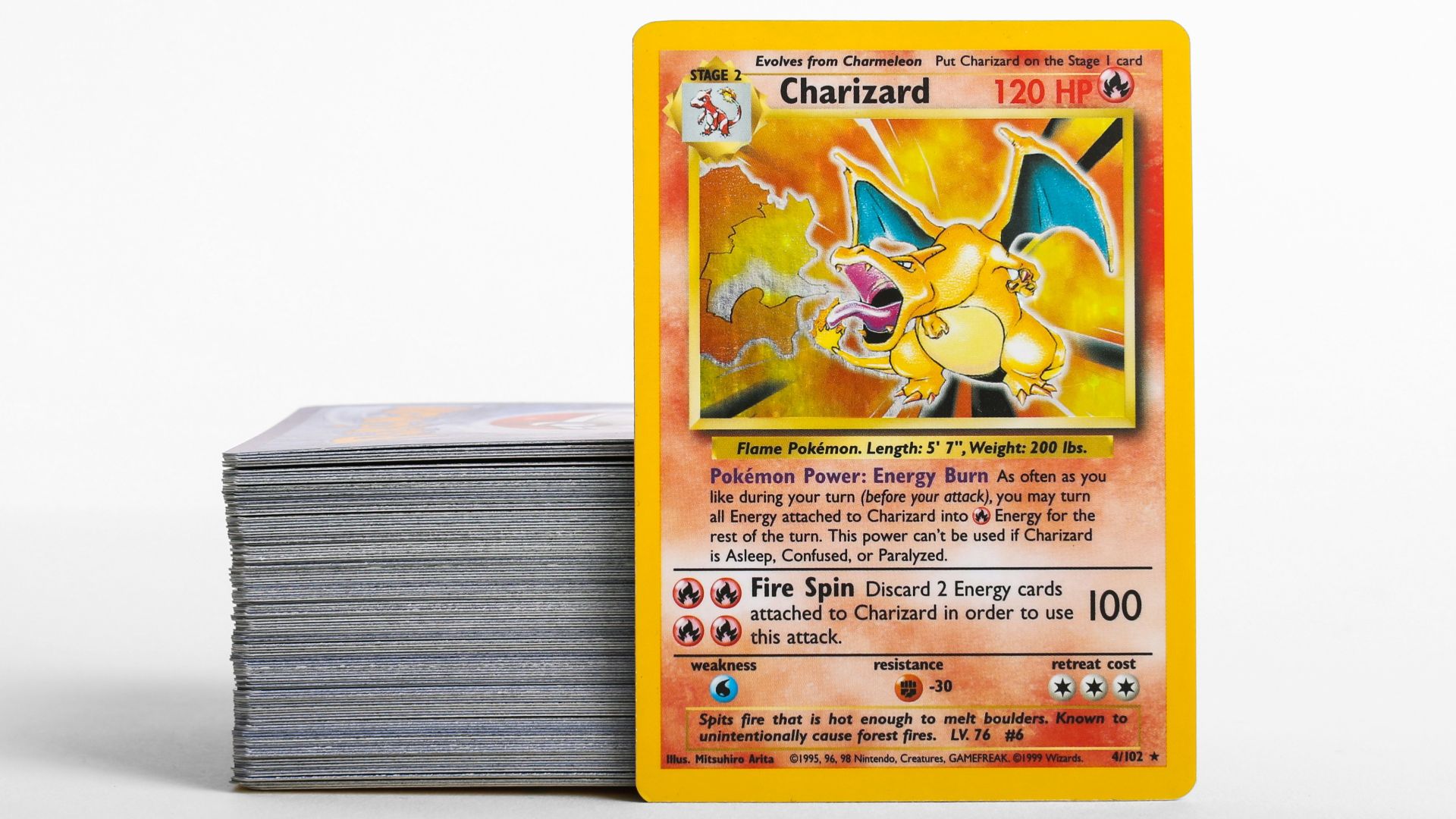 a stack of pokemon cards sitting on top of each other