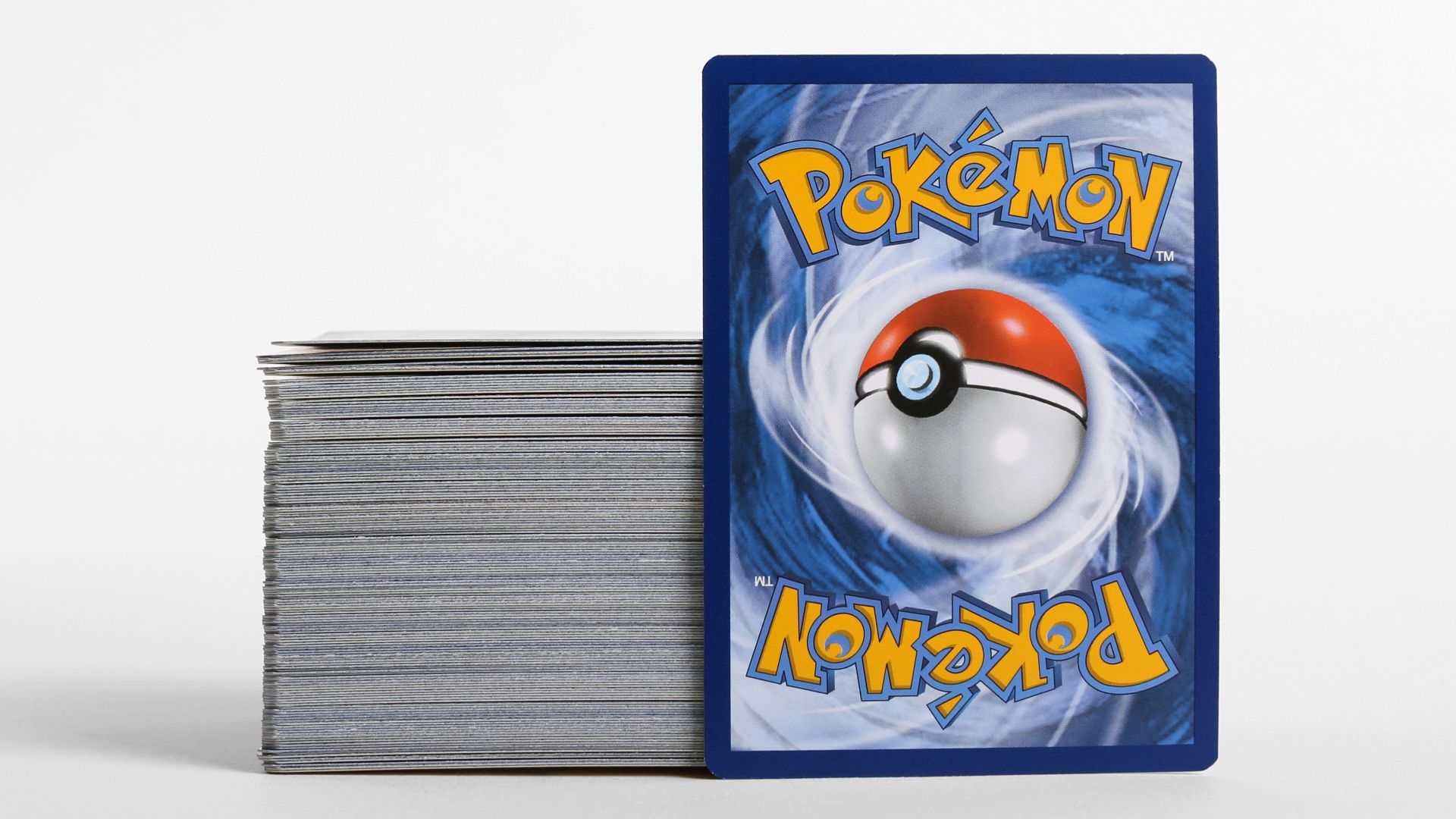 a stack of cards with a pokemon logo on them