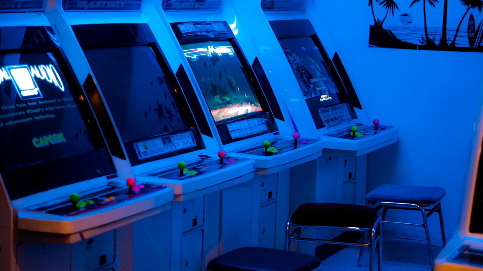 a room with a bunch of arcade machines in it