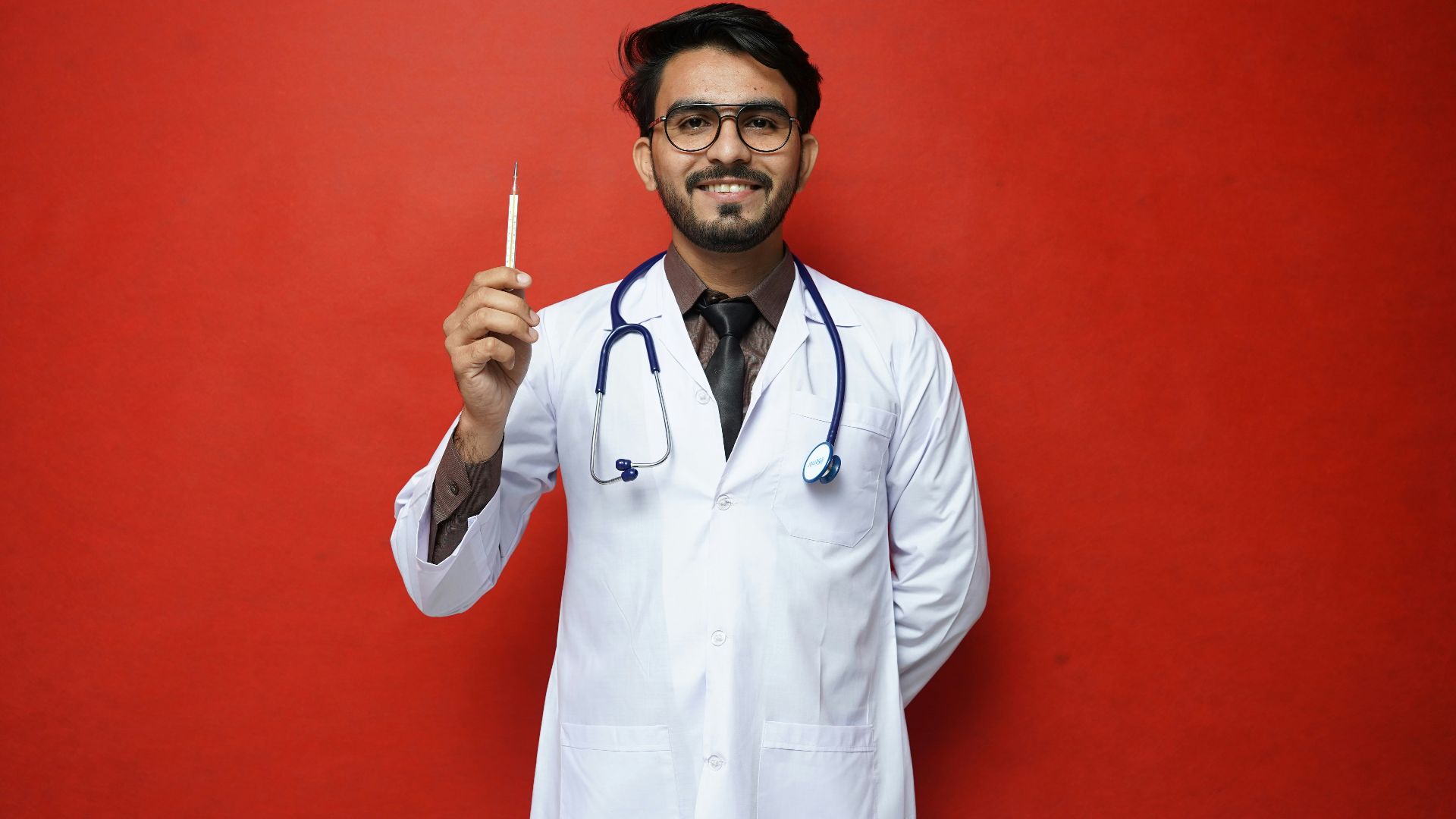 a doctor holding a syringe