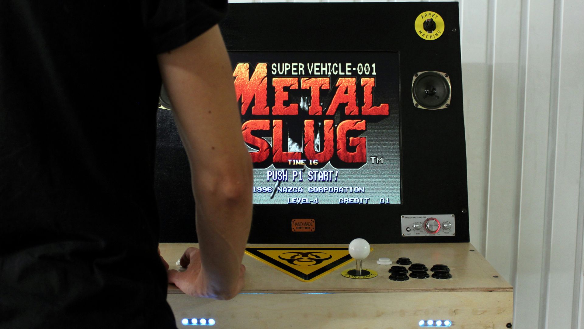 man in black t-shirt and blue denim jeans standing