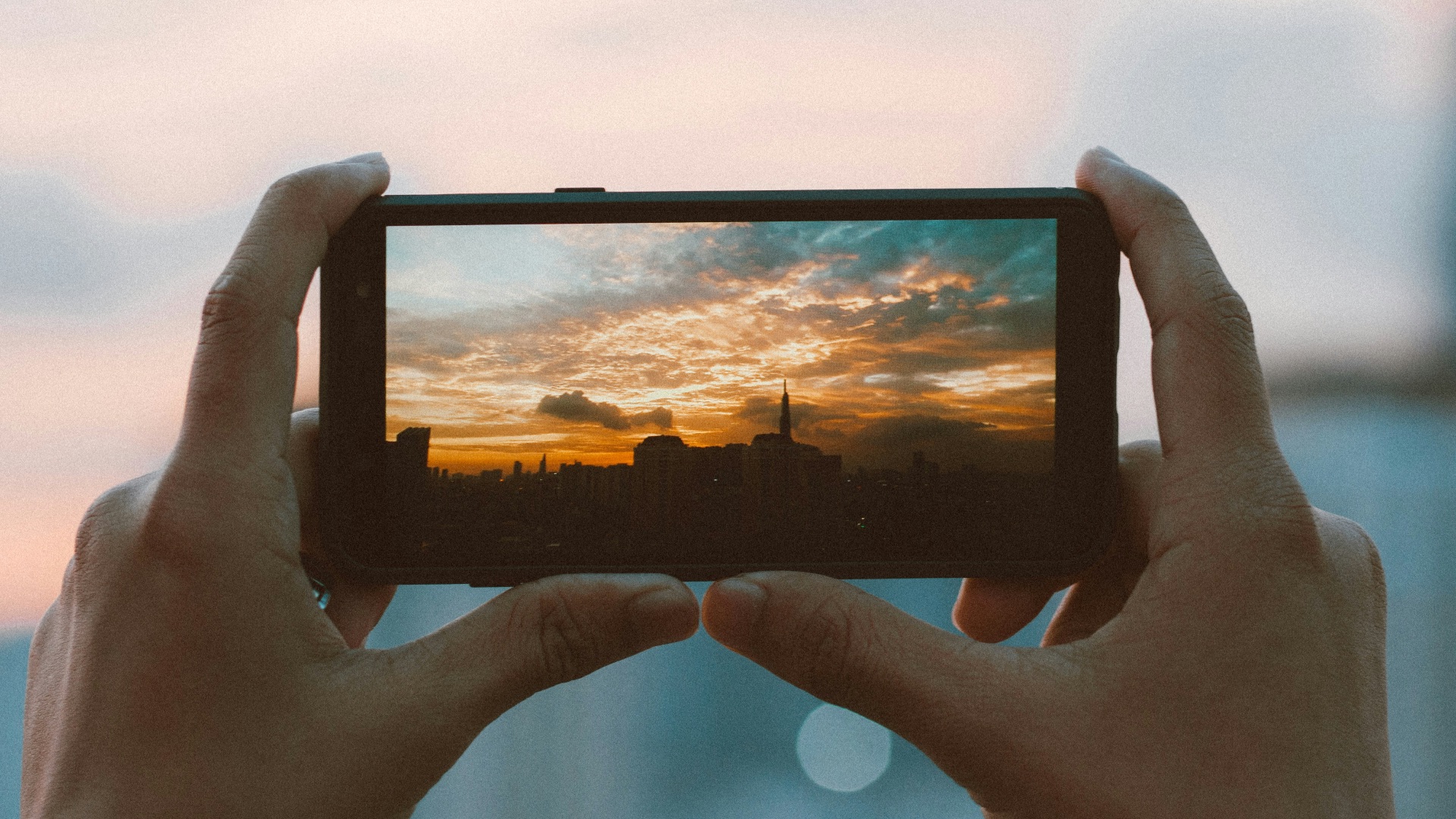 hands holding a tablet