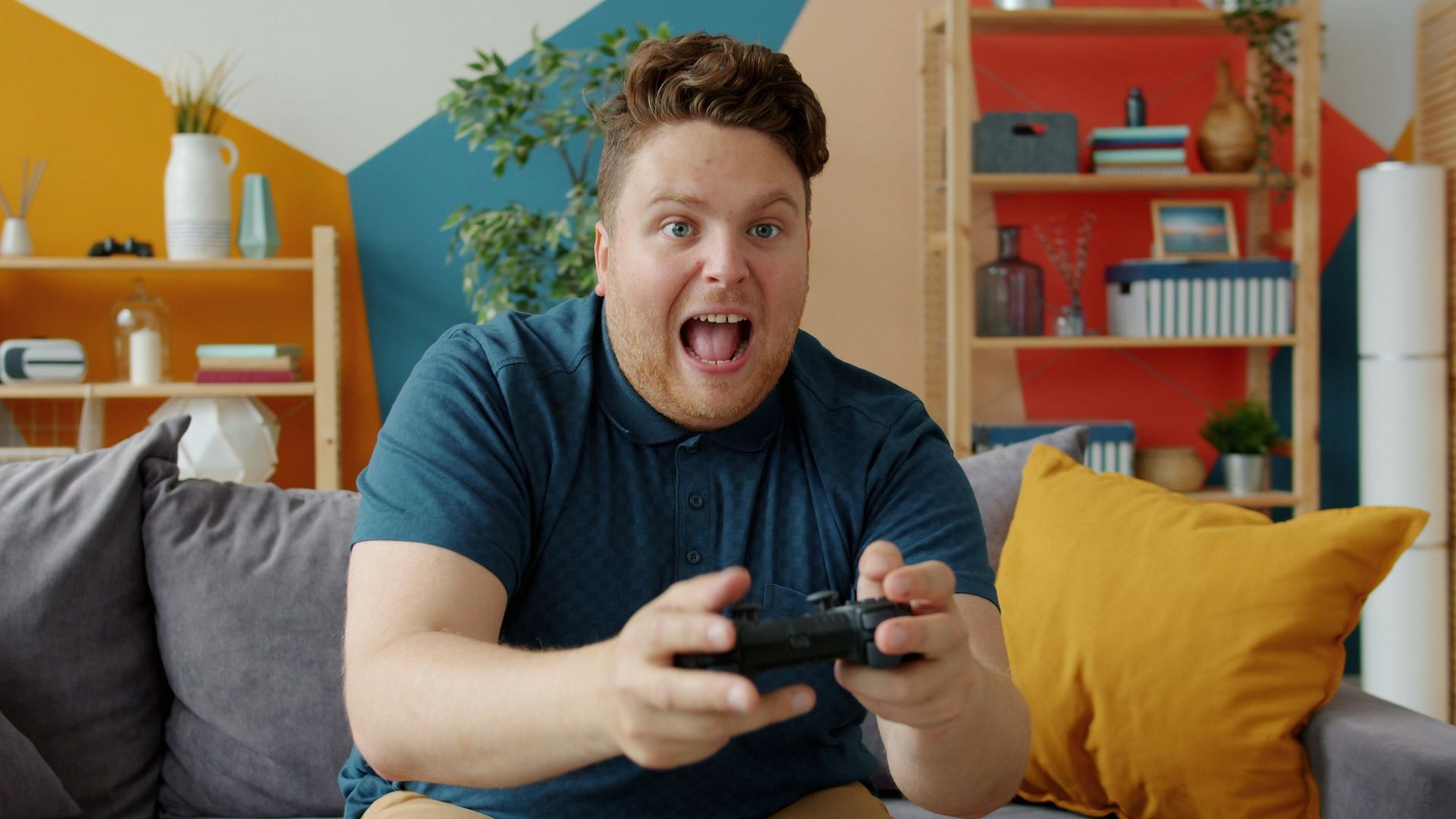 Man playing video games with excited expression