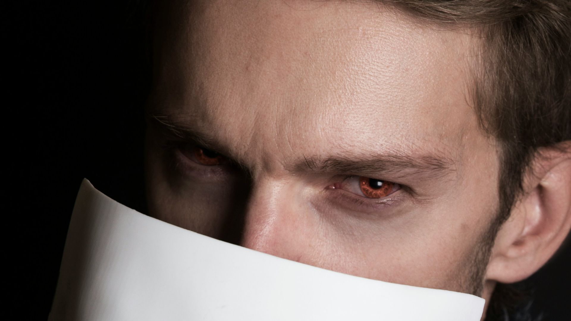 man with white face mask