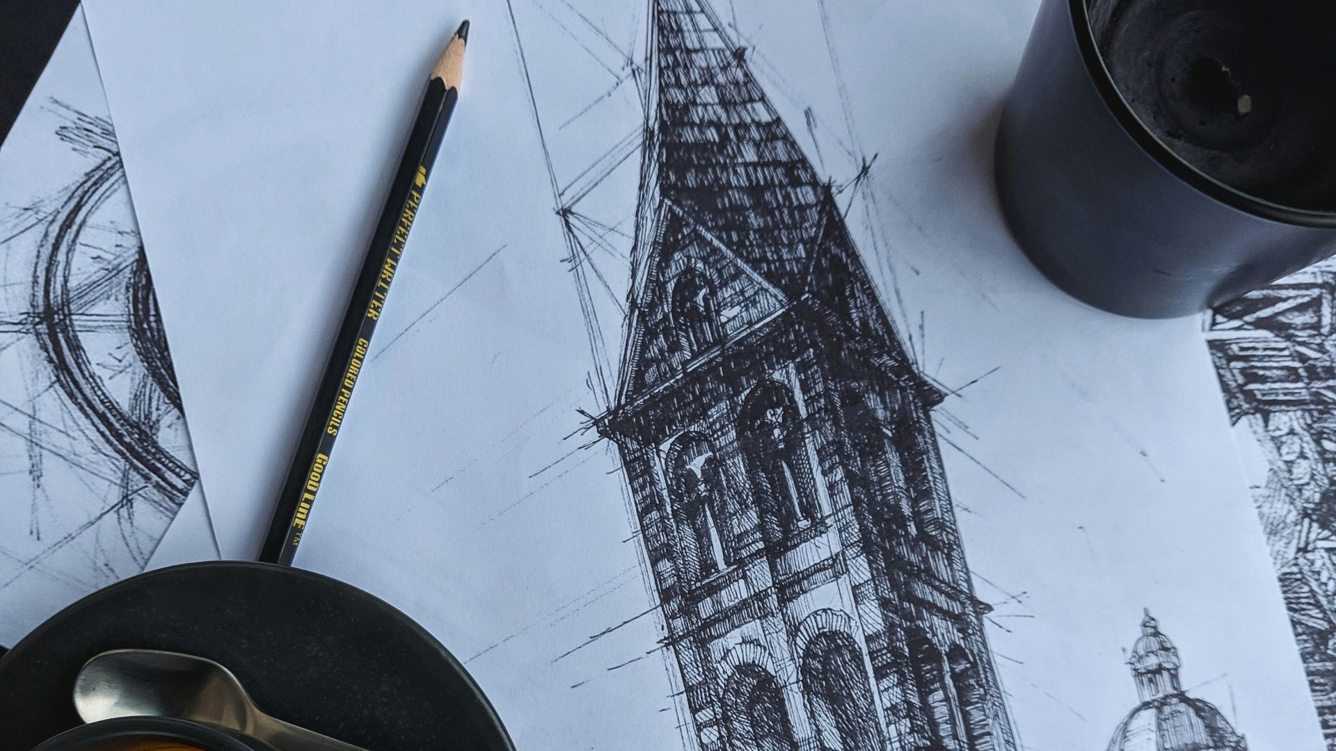 black ceramic mug with brown liquid on white and black table