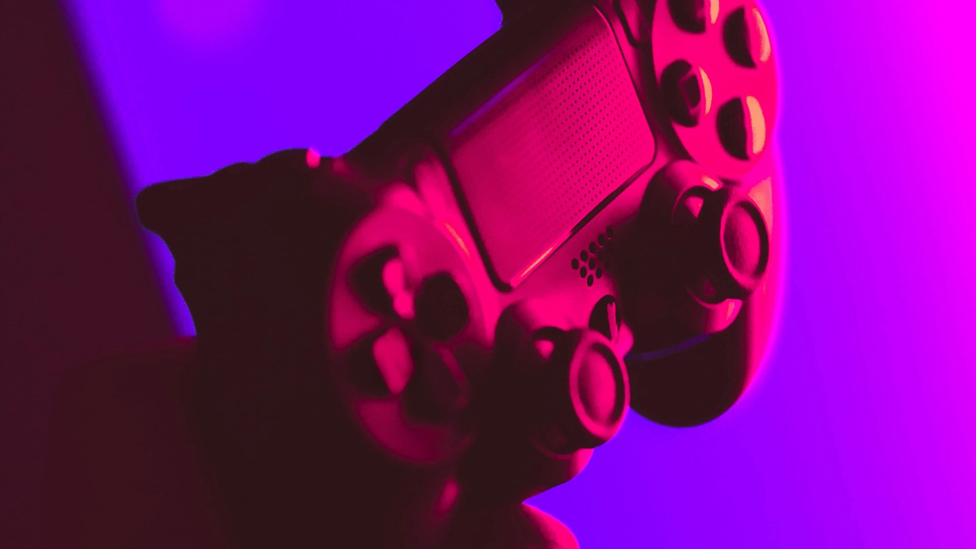 person holding black and gray game controller