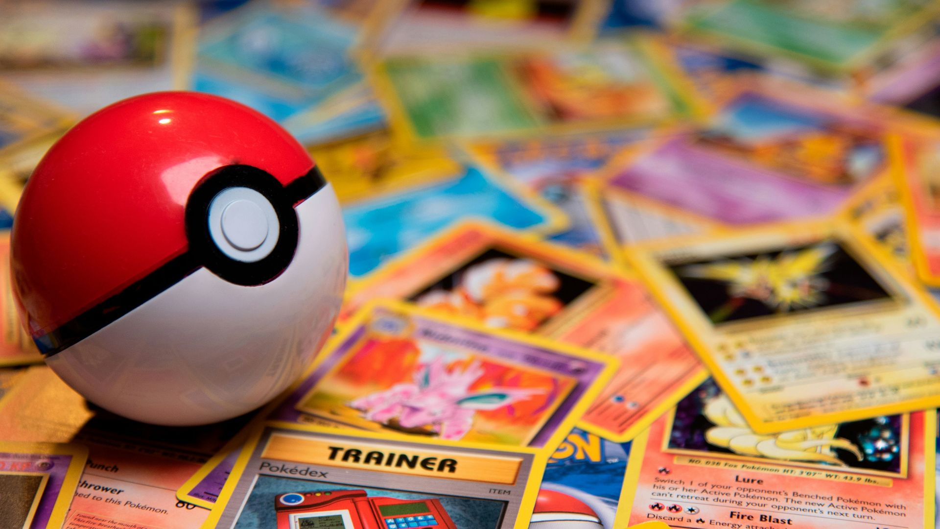 red and white ladybug toy on white and yellow book