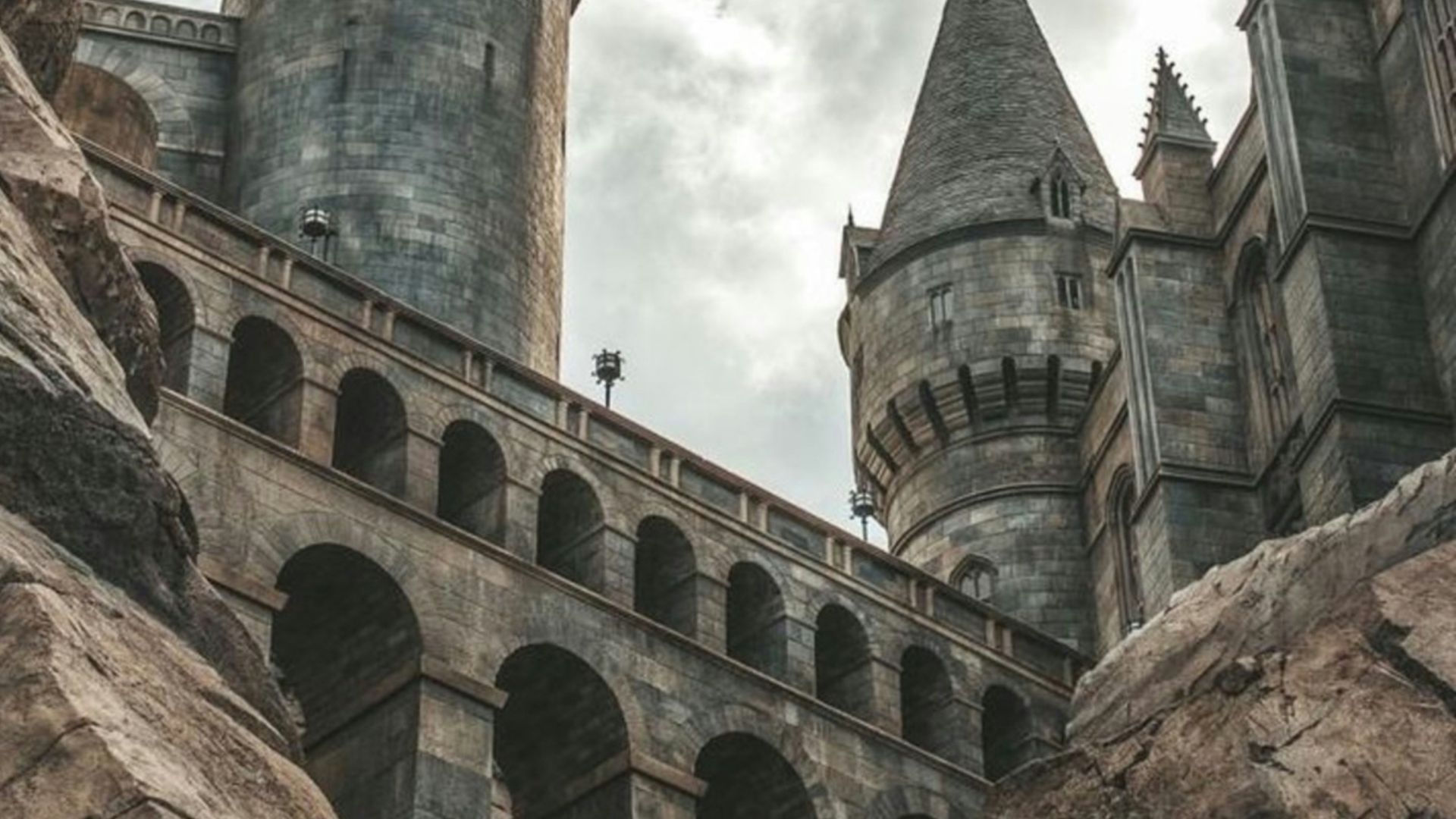 white clouds hovering above grey castle