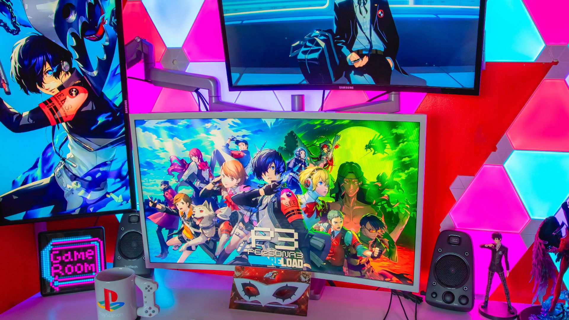 a desk topped with three computer monitors and a keyboard