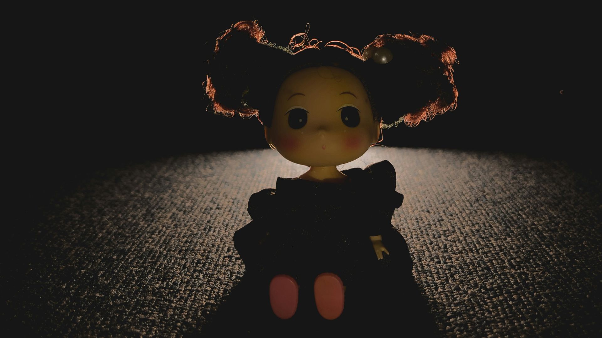 a toy doll on a surface