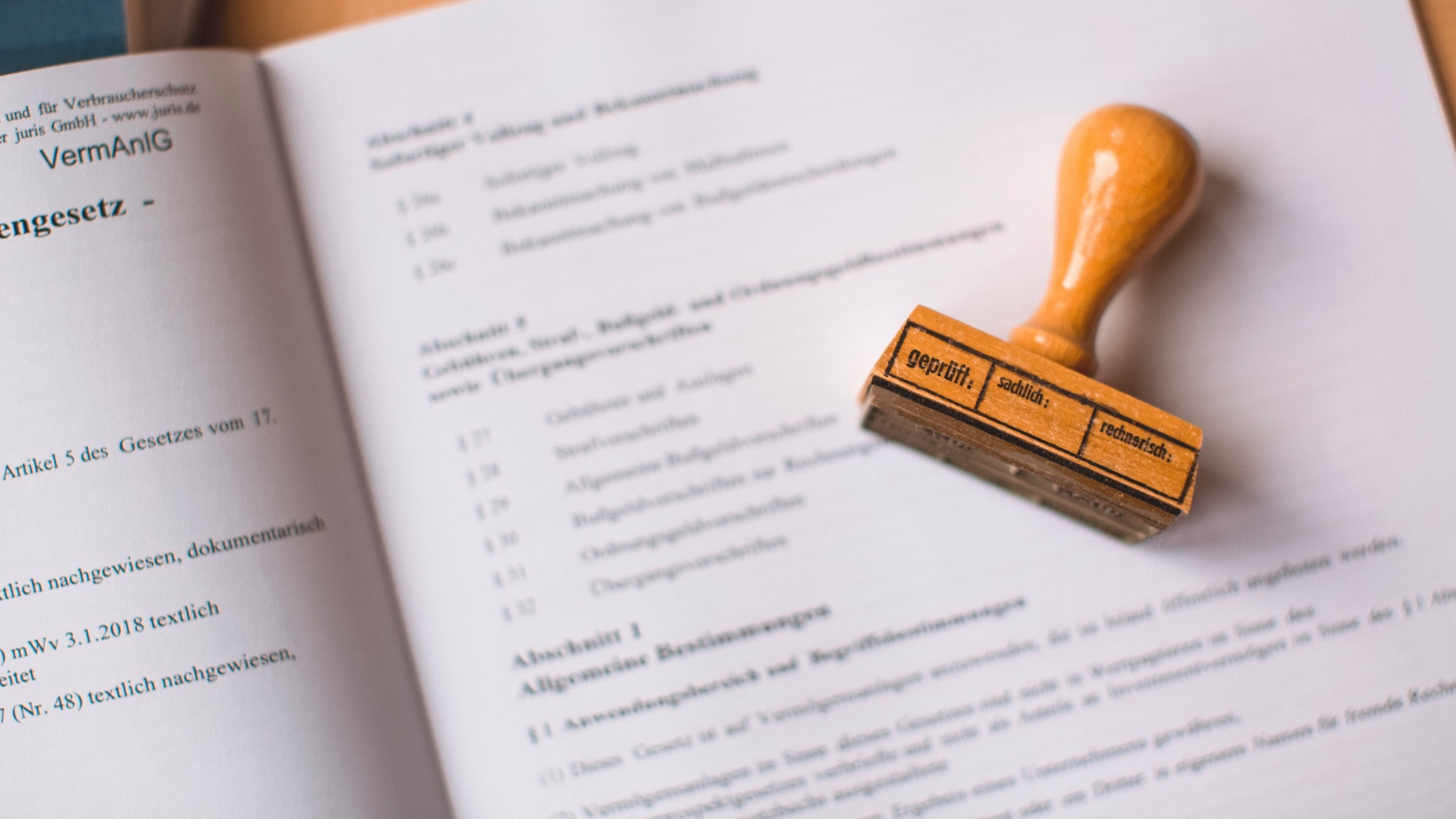 brown wooden hand tool on white printer paper