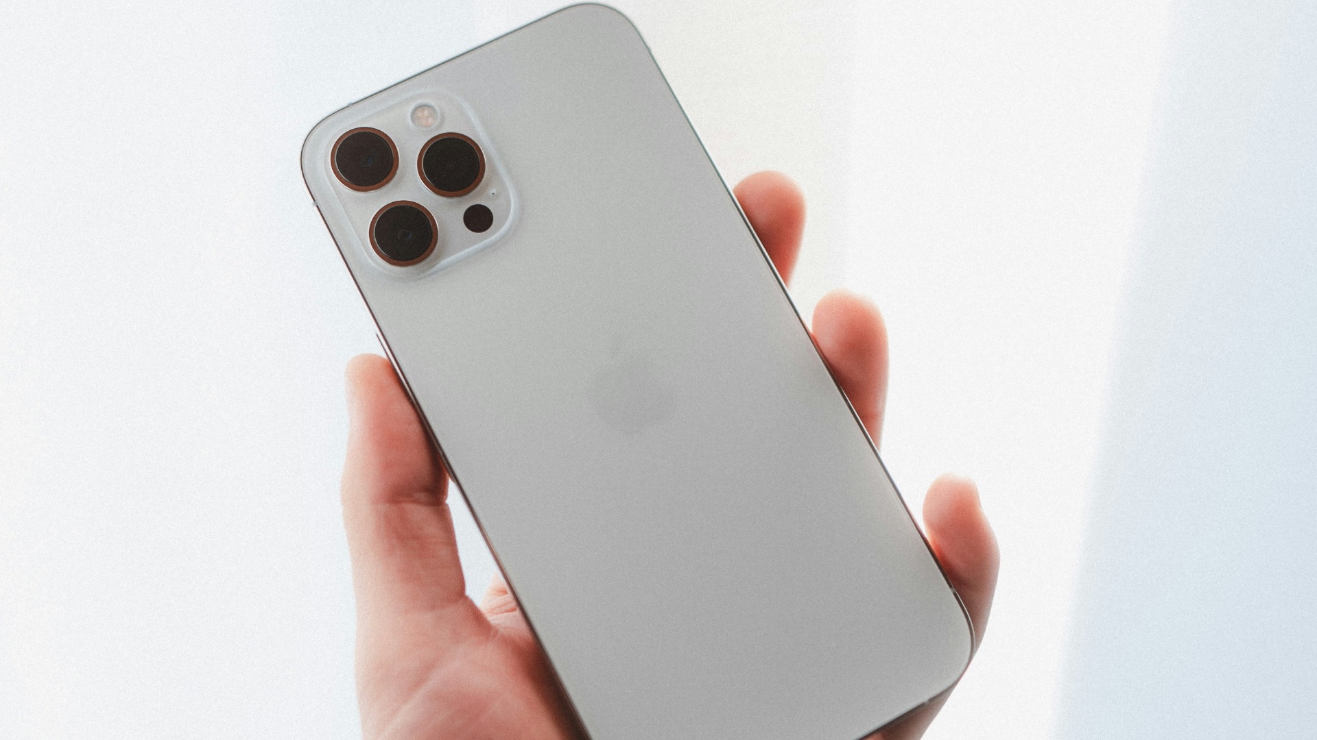 person holding silver iphone 6