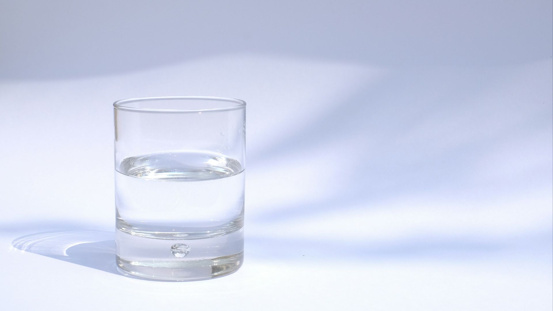 clear drinking glass filled with water
