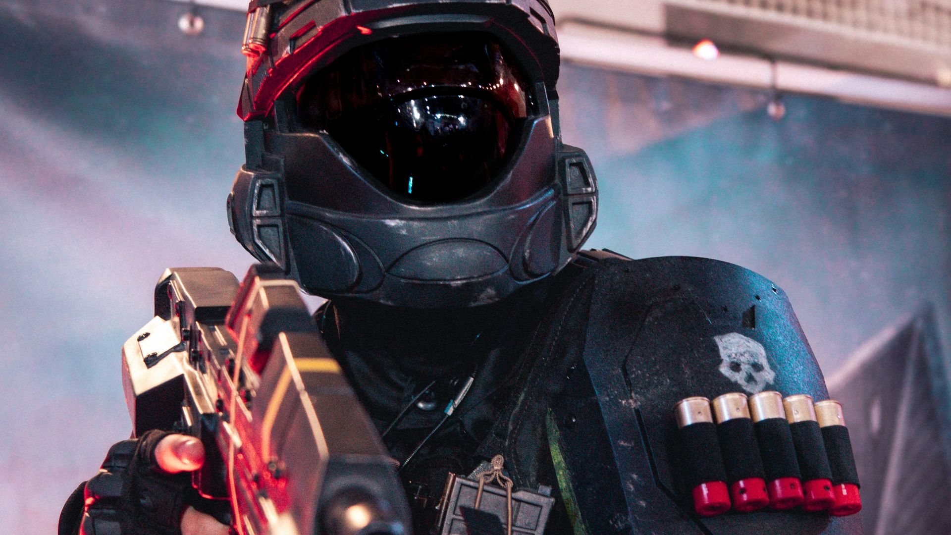 A man in a helmet holding a gun