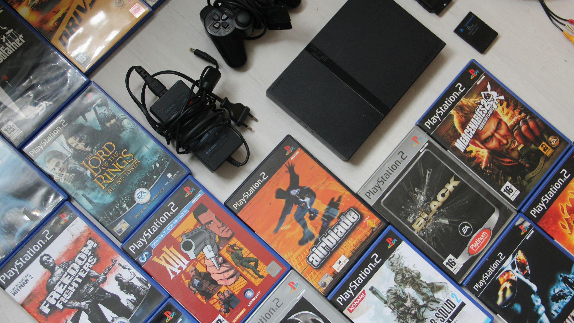 black sony dslr camera on white surface