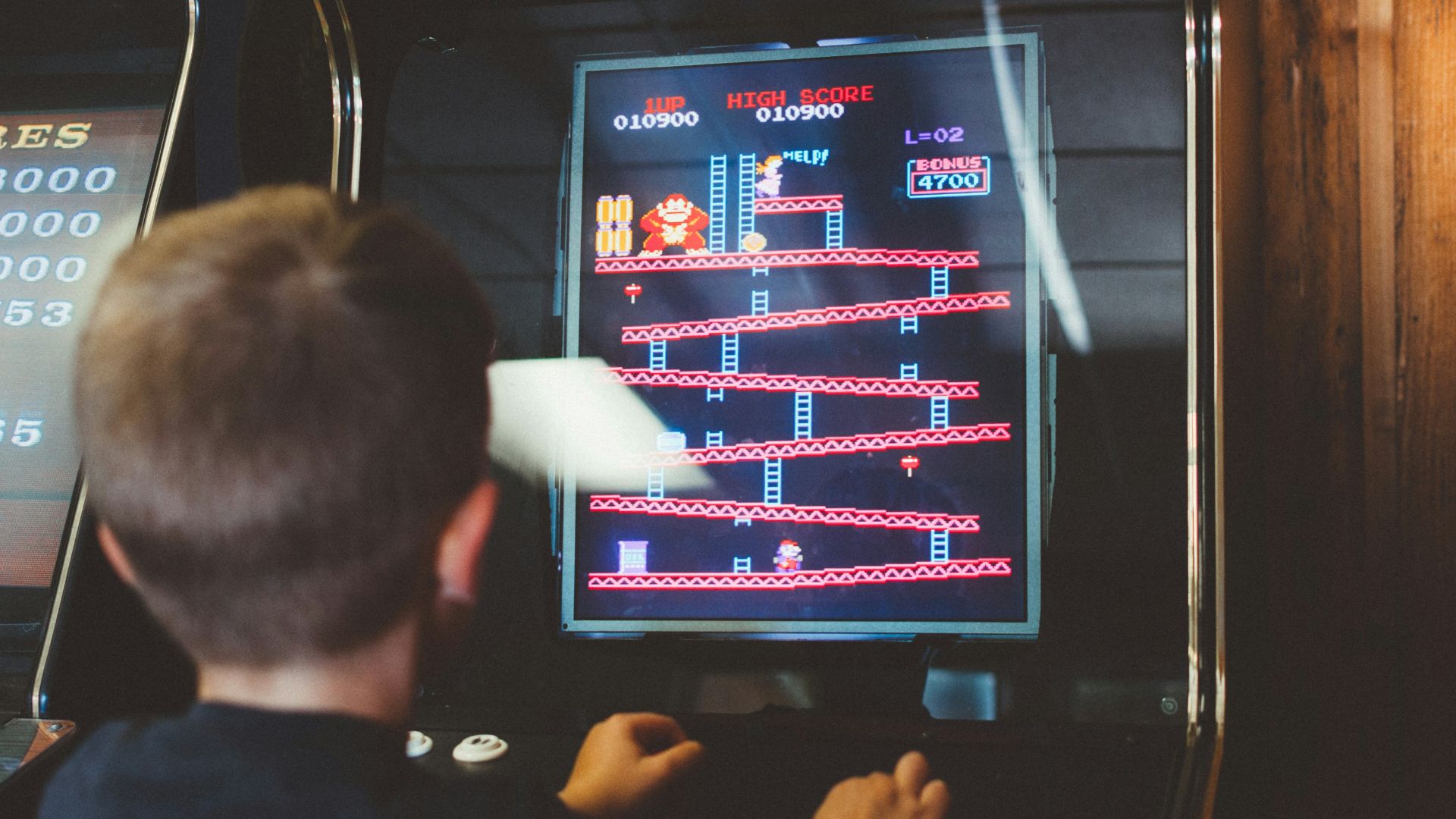 boy playing donkey kong arcade box