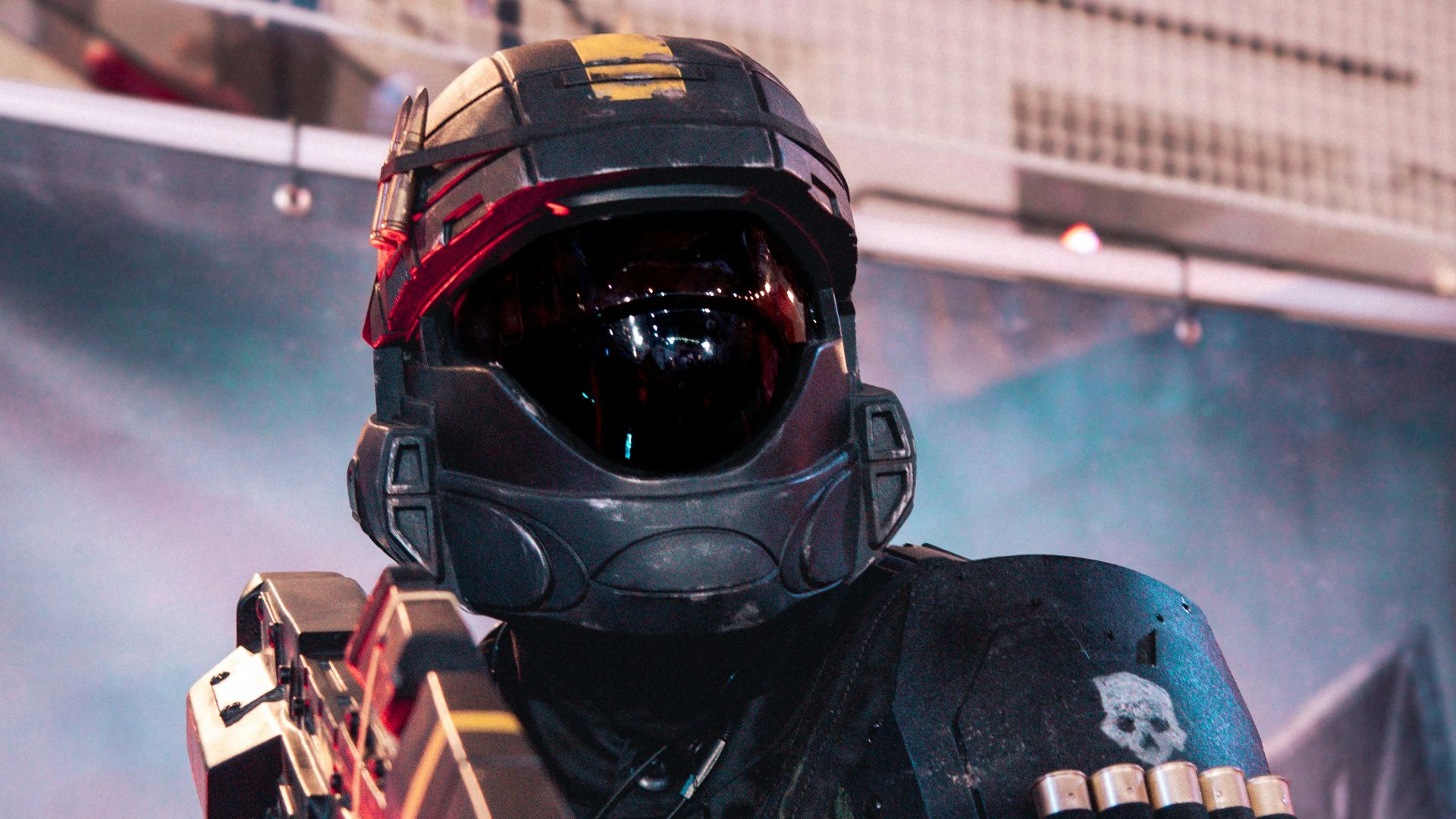 A man in a helmet holding a gun