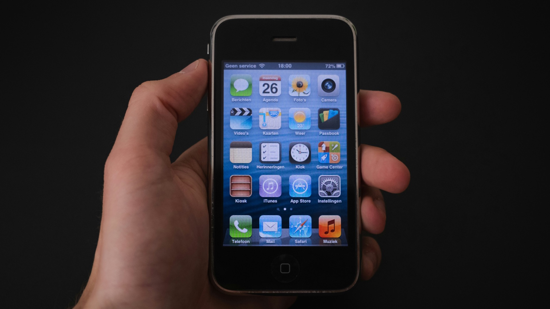 person holding black iphone 4