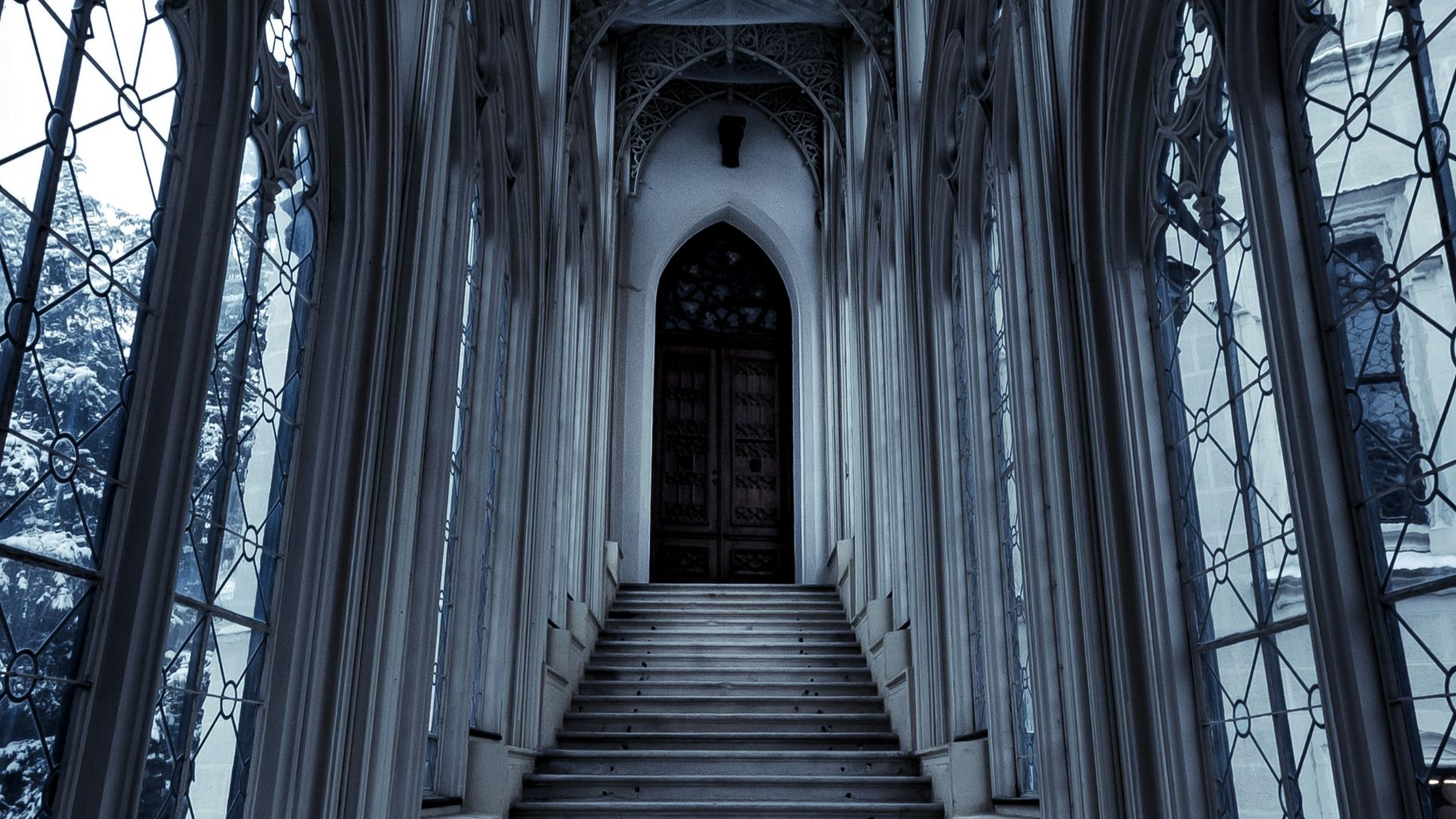 a set of stairs leading up to a large window