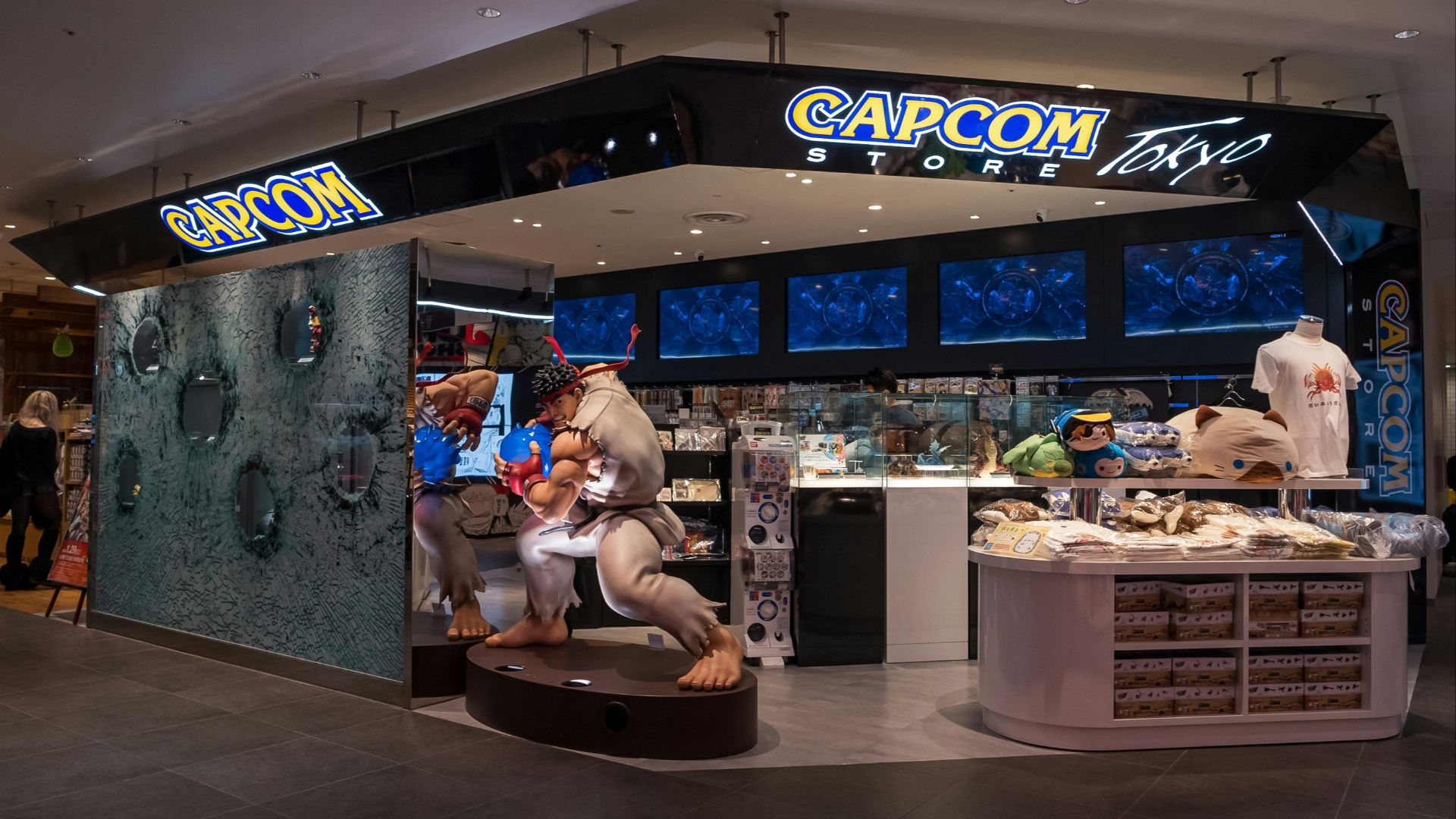 a store with a statue of a man holding a baby