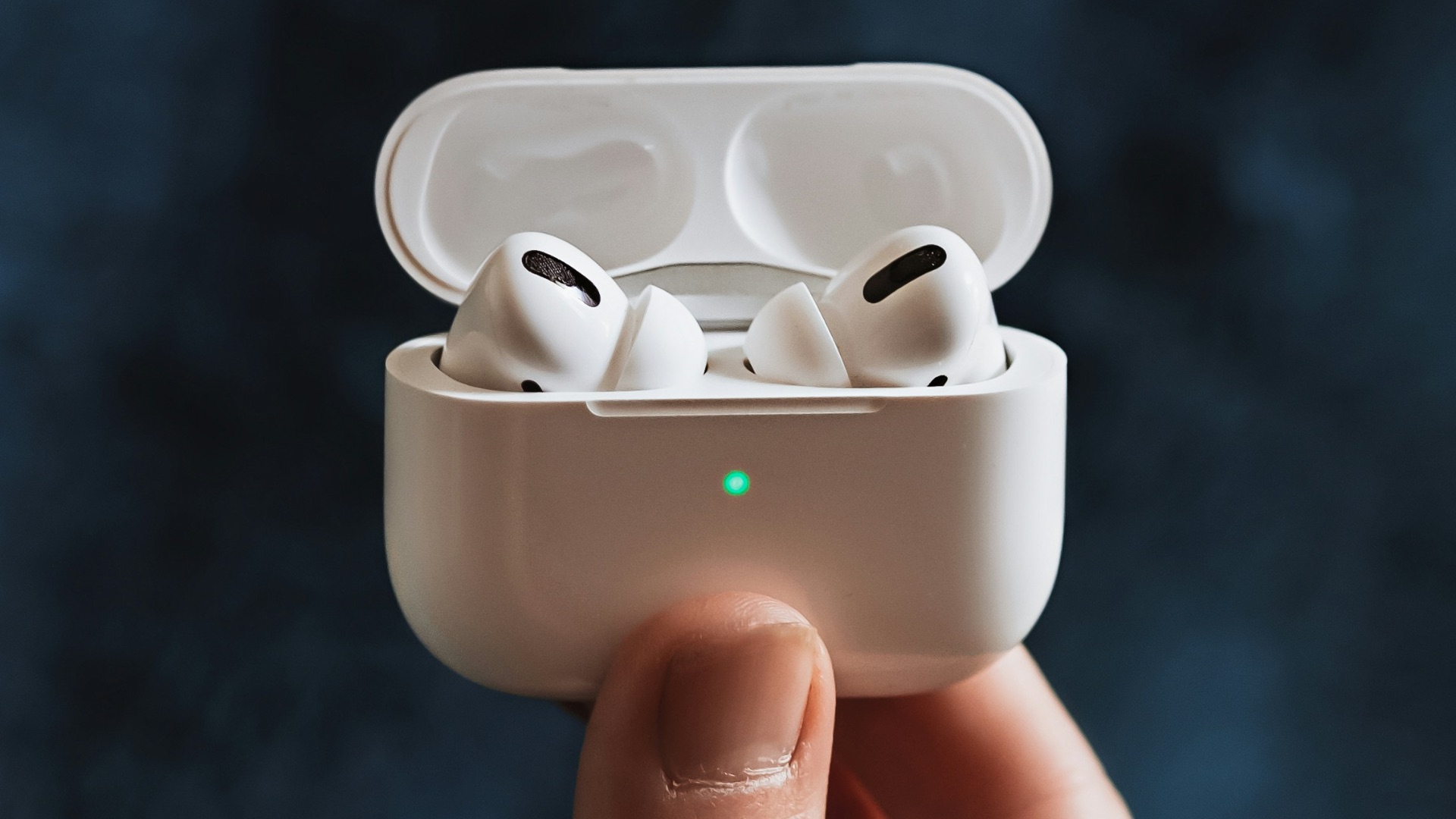 person holding white plastic container